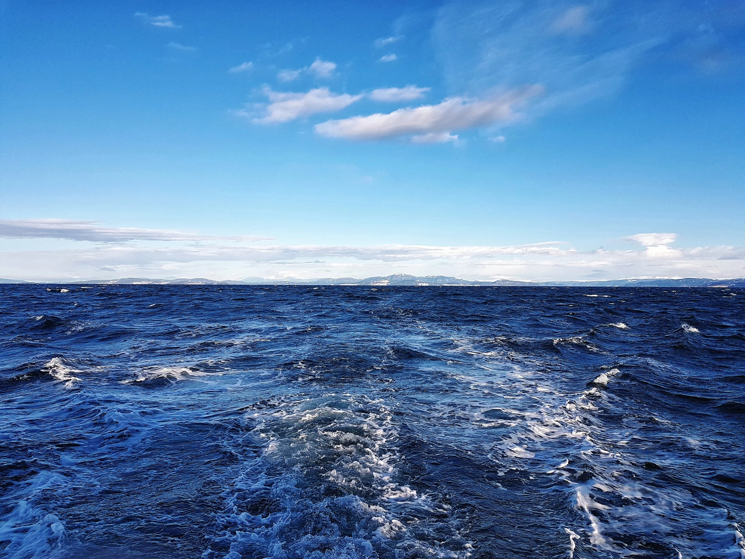waves behind ranja fjord bluesky.jpeg