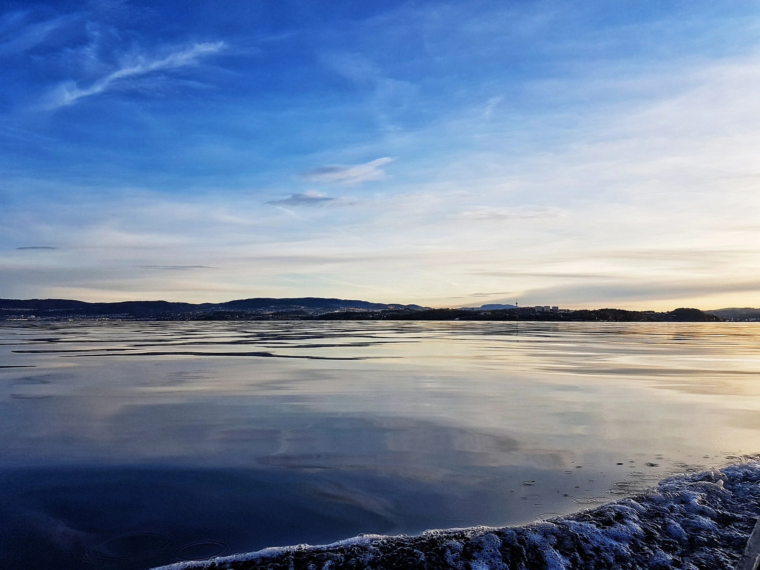 reflections fjord sunset movement bluesky.jpeg
