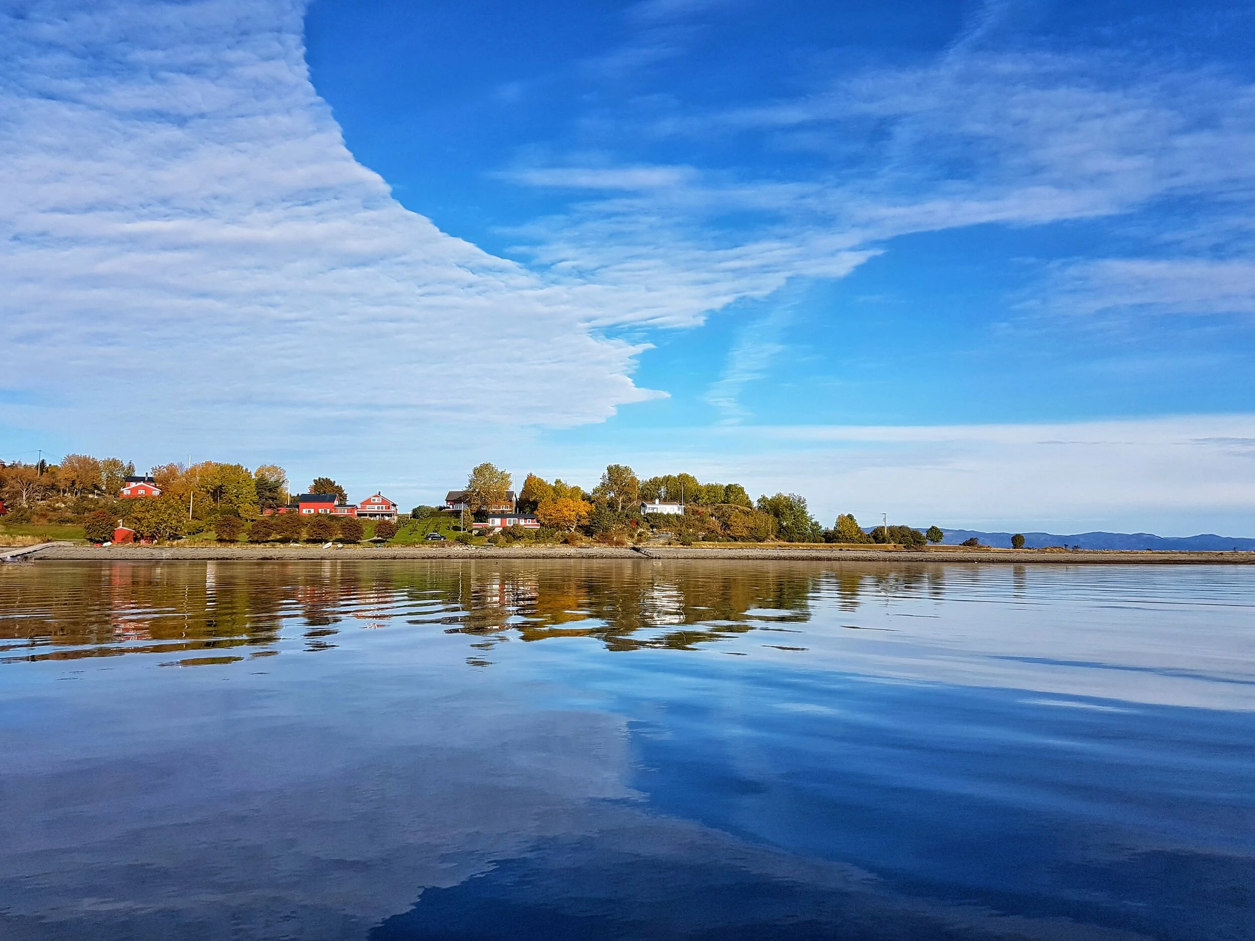 tautra reflection bluesky arrival.jpeg