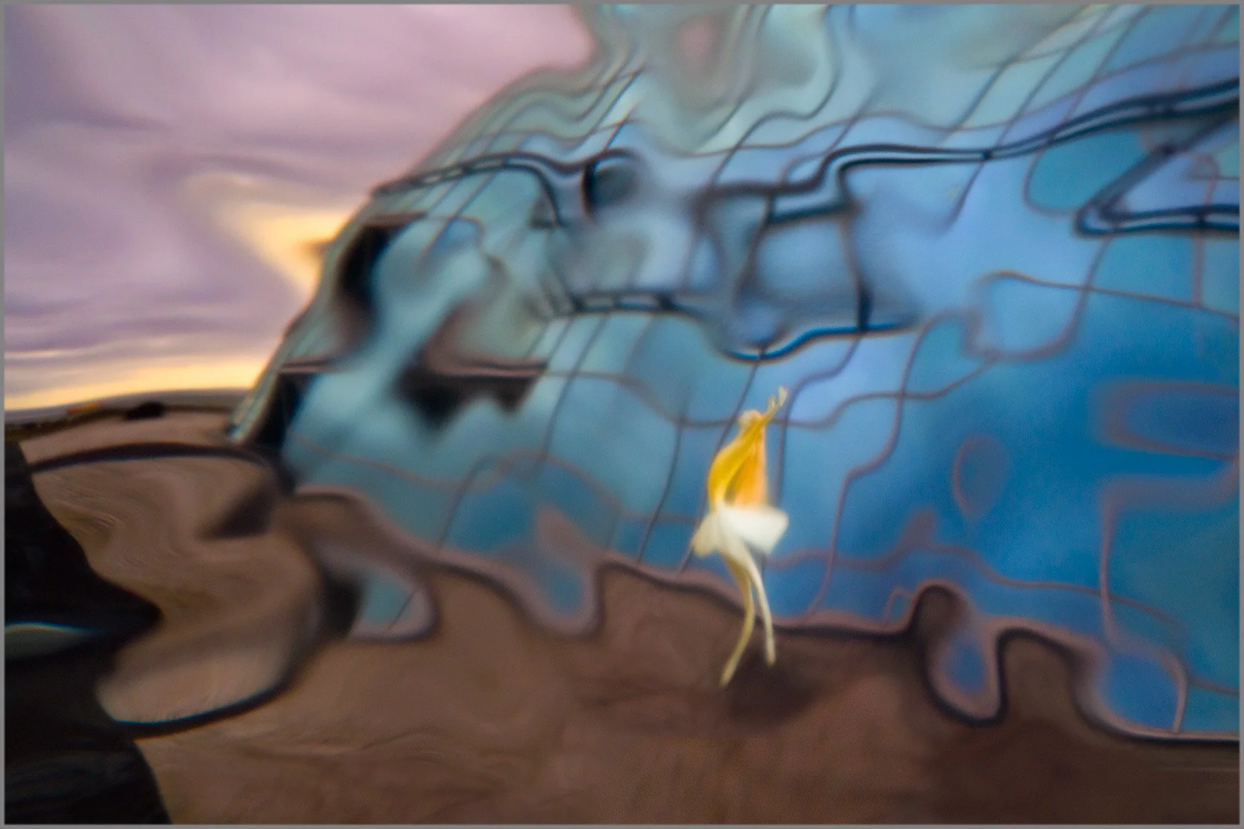 A distorted dancer within a landscape