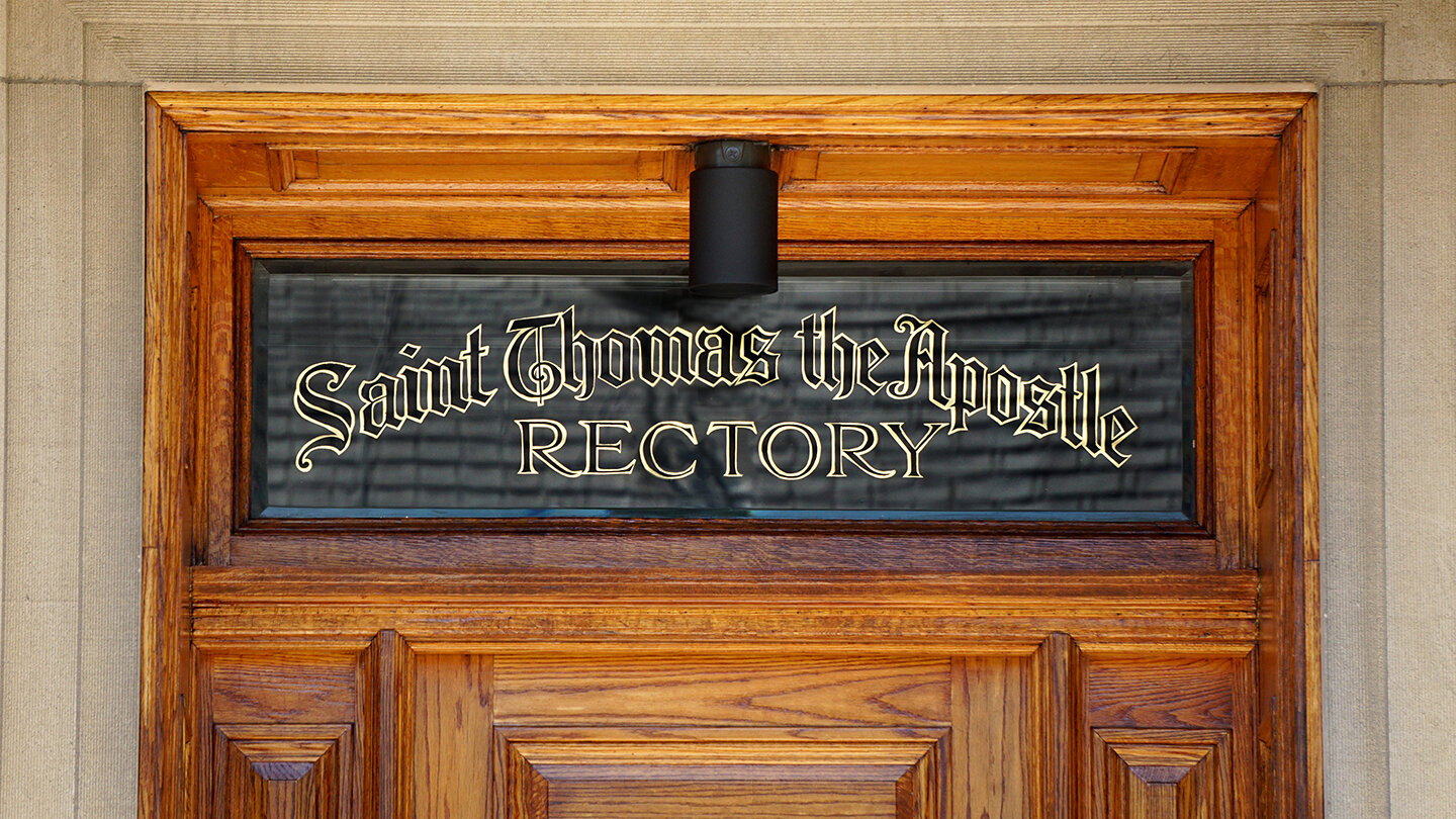  Reflective transom gilding reading “Saint Thomas the Apostle Rectory” in blackletter decorative lettering 