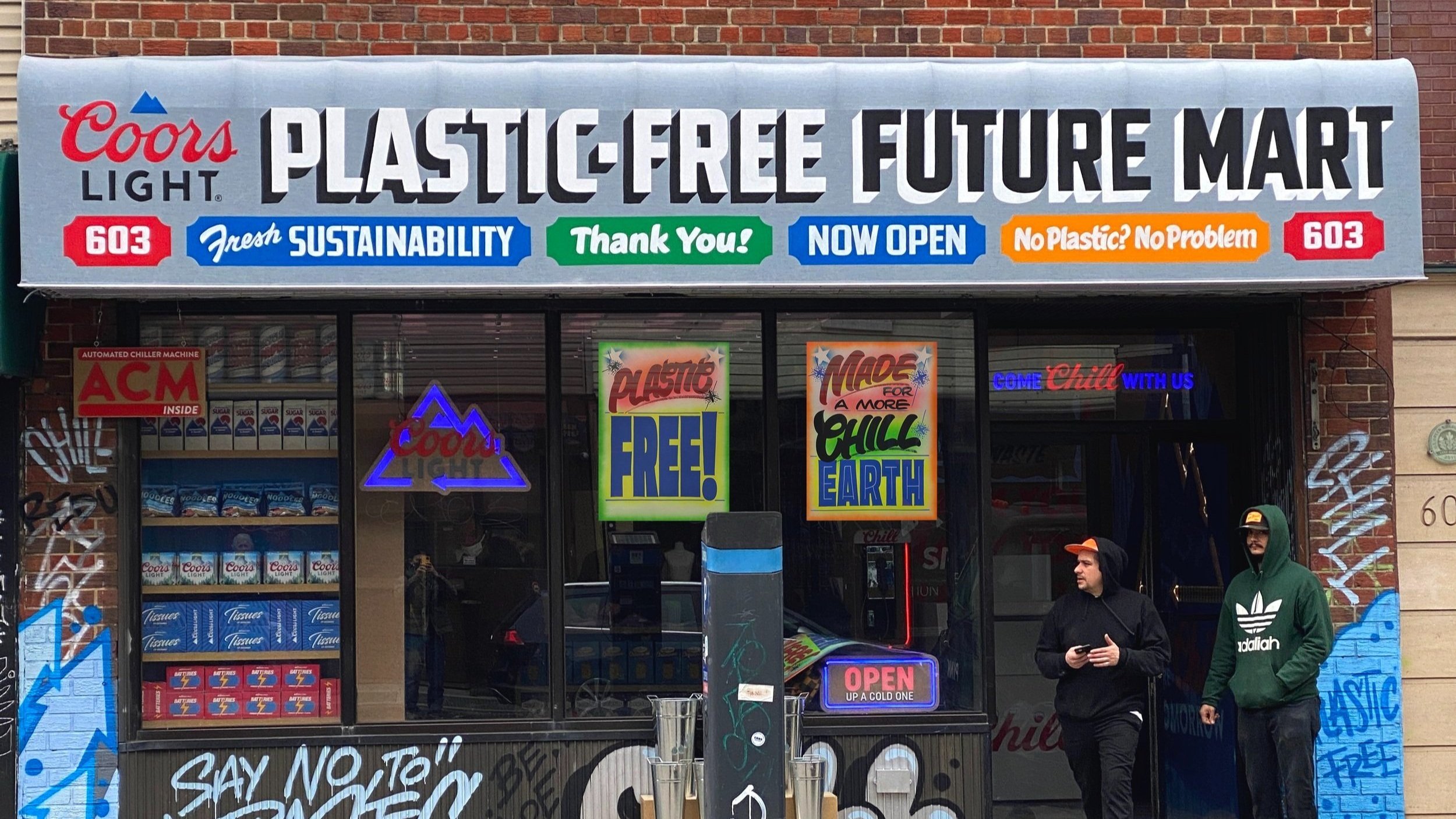  Storefront awning reading “Coors Light Plastic-Free Future Mart” in black and white, with bodega-inspired signage elements in primary colors, for a pop-up shop event  