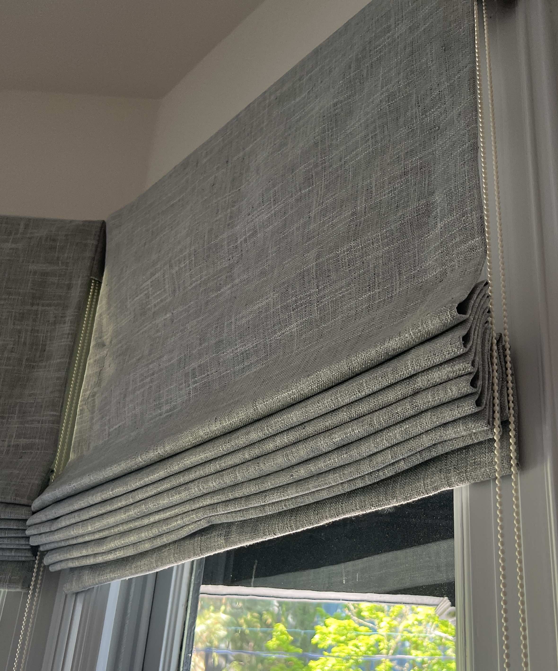IMG_7637-Whitney's_custom_roman_shades_with_hidden_back_dowels_in_entry_hall_partially_raised.jpeg