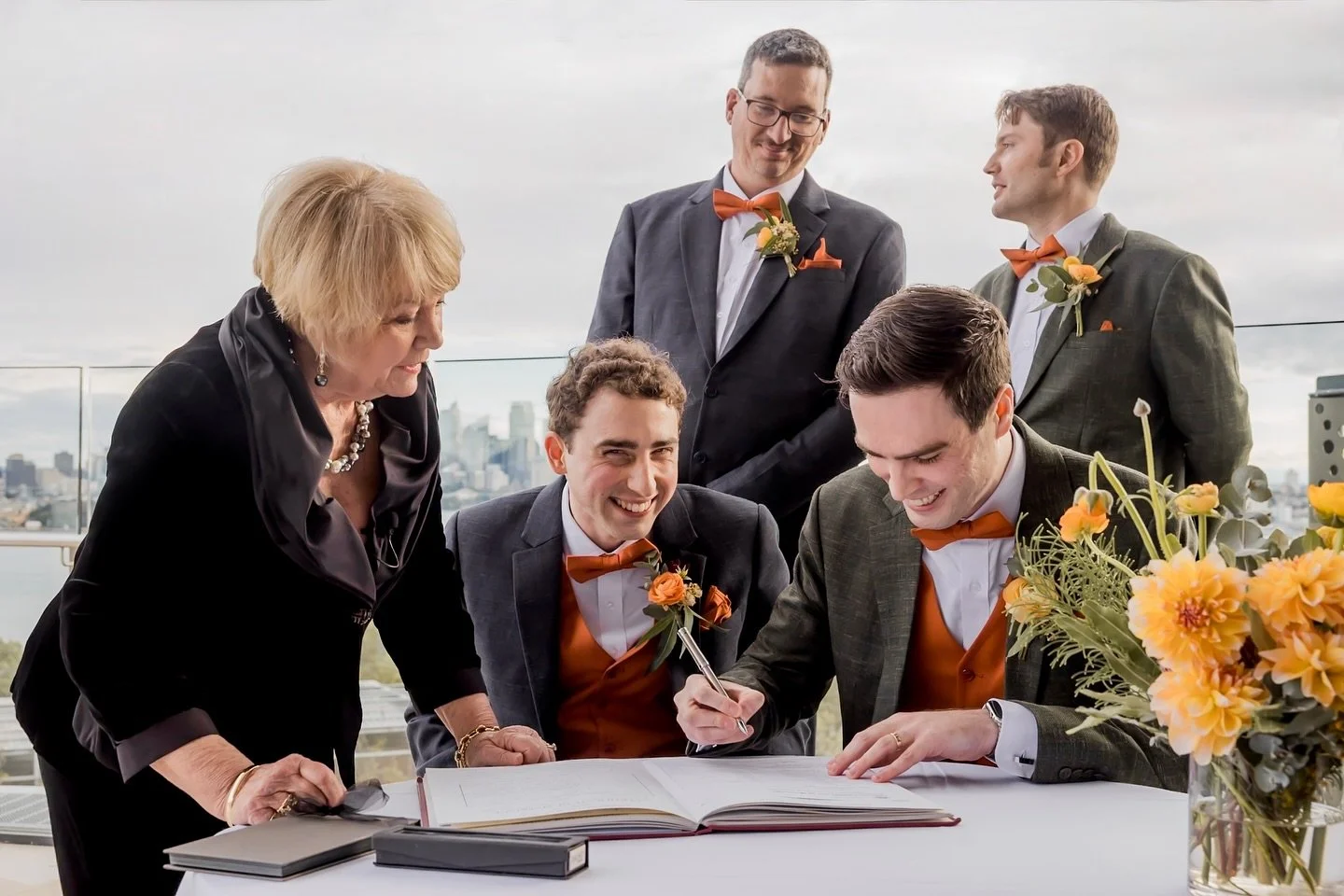 Giggling through the paperwork! 📝💛 
These two couldn’t stop smiling while signing their marriage certificate at Taronga Zoo. Love, laughter, and a little bit of mischief—this is exactly how we love to capture weddings. 🌿✨❤️🌈
Aren&rsqu