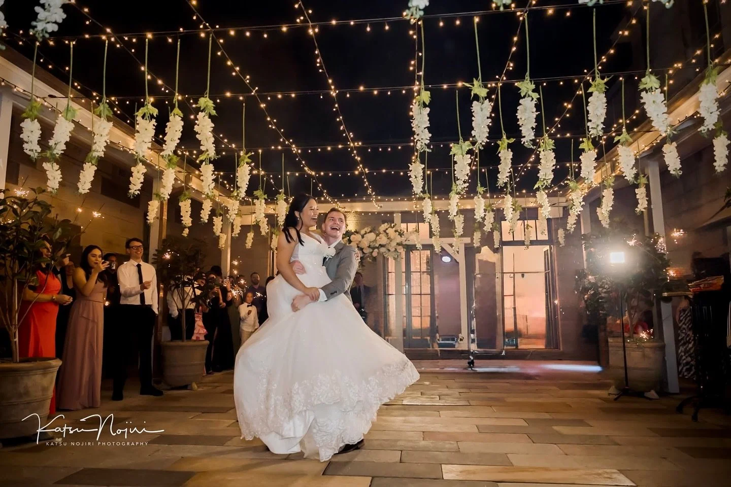 There&rsquo;s something truly magical about a Gunners&rsquo; Barracks wedding ✨ During their first dance, he lifted his bride and swung her around under a sky of fairy lights, hanging flowers, and twinkling stars. 
Capturing these joyful, authentic m