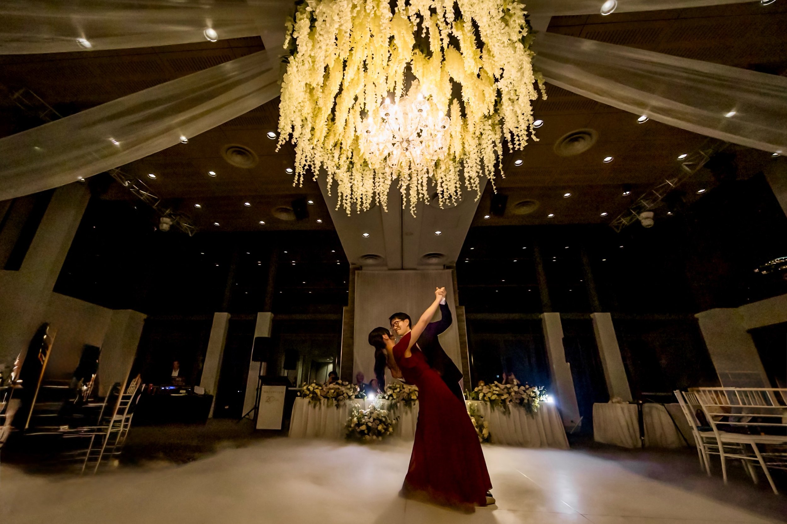 That moment when the music fades and it&rsquo;s just the two of them ✨✨✨

A stunning first dance at Waterview in Bicentennial Park &mdash; one of the most sought-after wedding venues in Sydney. The chandelier, cascading florals, and low fog created t