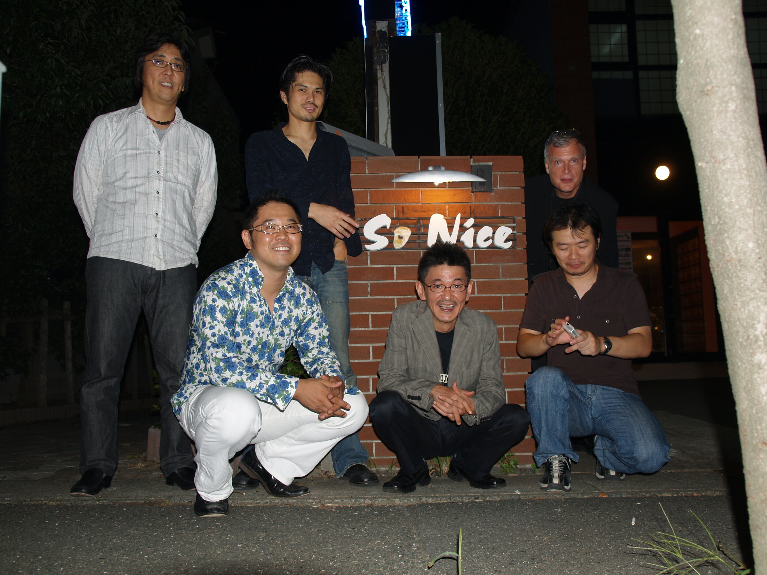 band posed at So Nice club.JPG
