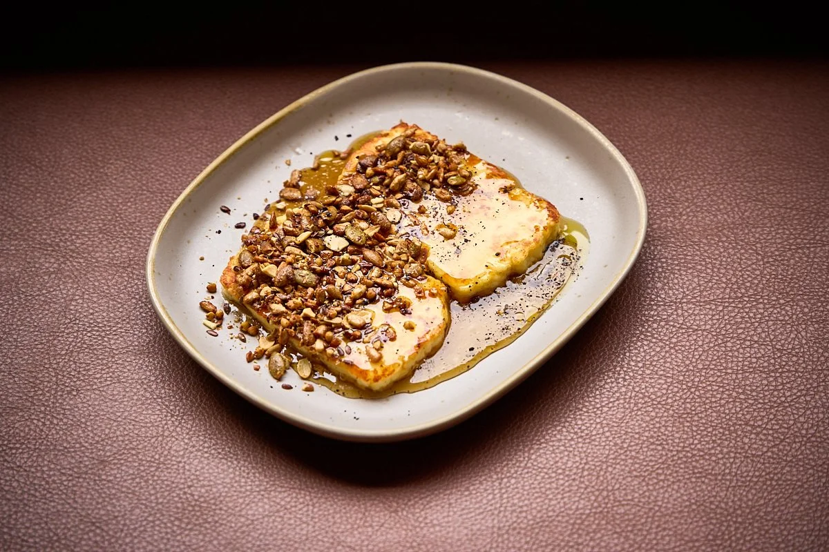 TheKyn-haloumi with olive oil, hot honey, and toasted seeds.jpg
