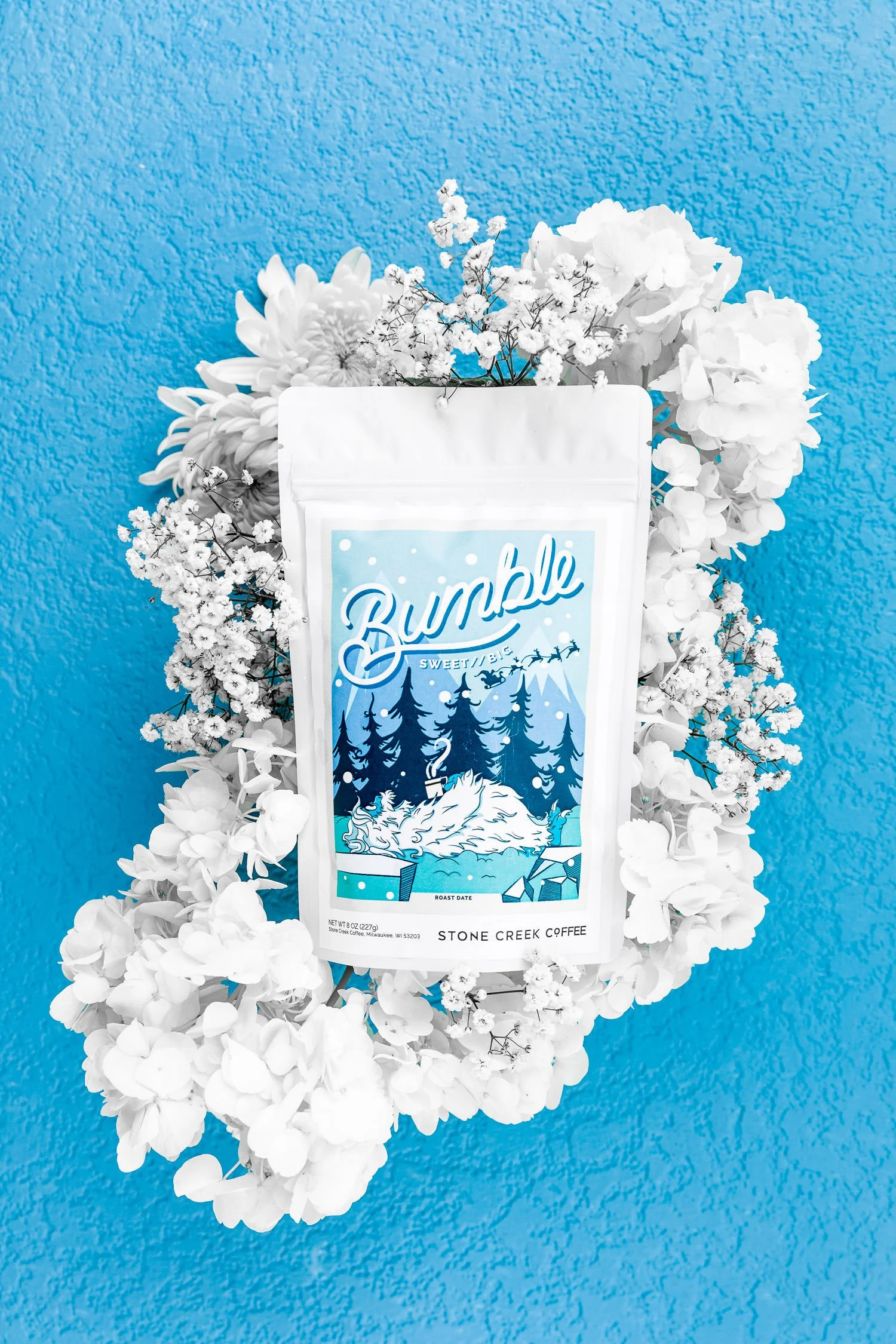 Bumble on blue background with white flowers3.jpg