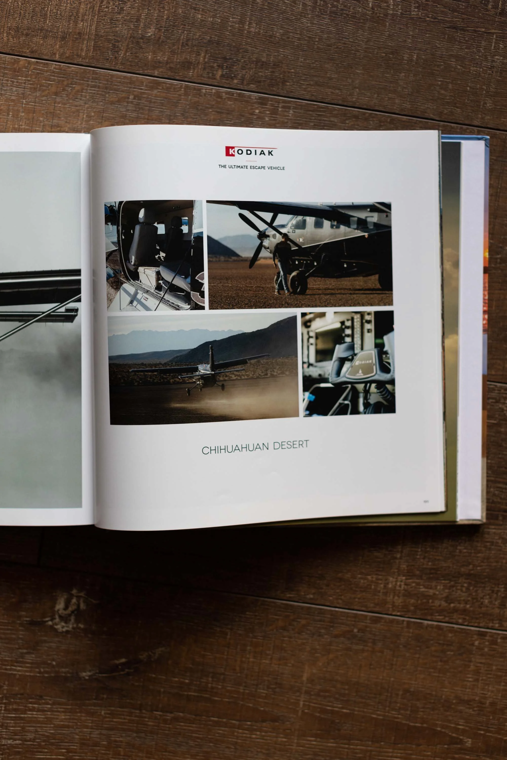 Open book showing pages with images of an aircraft in a desert setting, labeled 'Kodiak The Ultimate Escape Vehicle' and 'Chihuahuan Desert.'