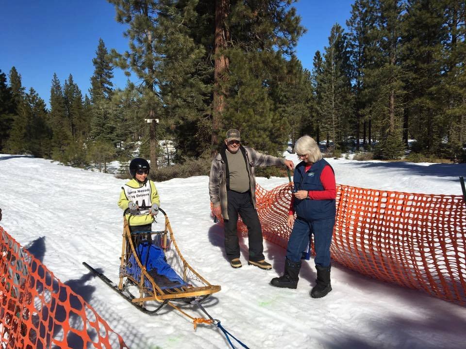 Junior Musher Zachary Briggs with Timer, Cari Hinesly and Race Marshall, Hugo Antonucci