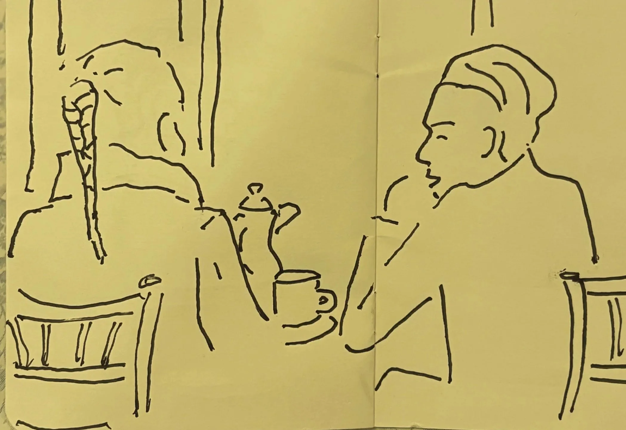 People sitting outside a café enjoying the first warmer days of spring.