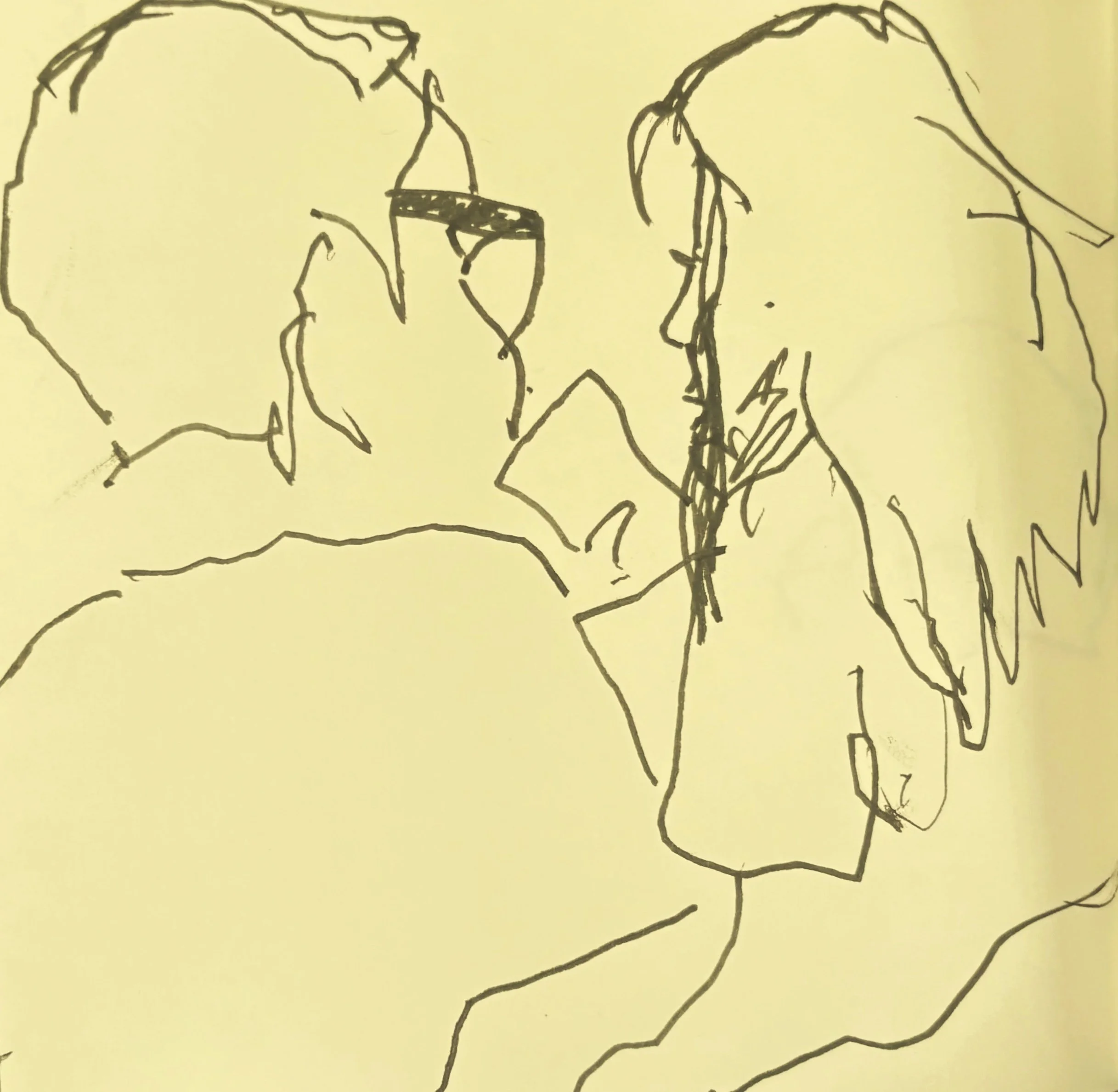 Two people sitting together talking at a table, simple line drawing