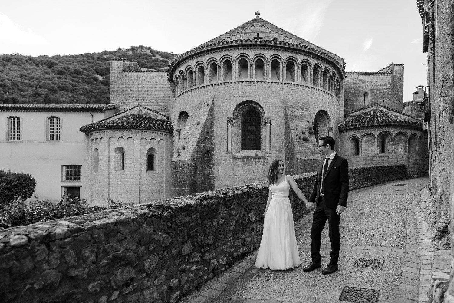 couple stand by church Wedding in Saint Guilhem le Desert France