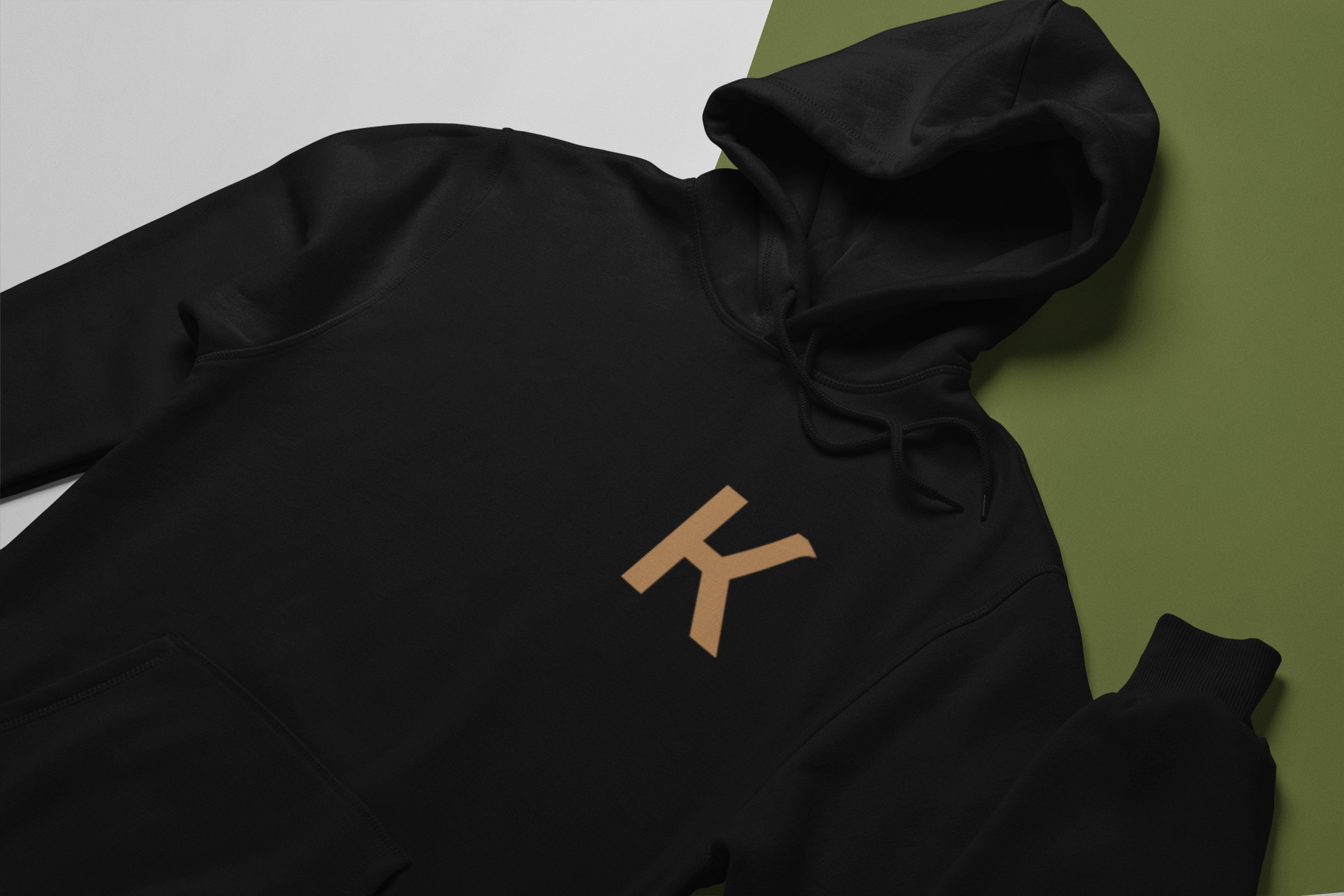 mockup-of-a-hoodie-lying-over-a-surface-with-two-colors-24257.png