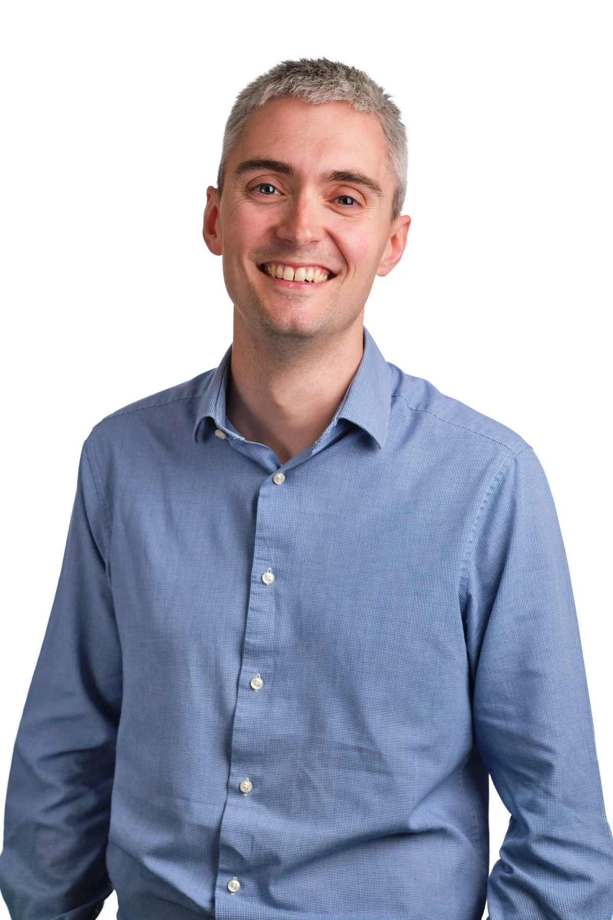 Professional headshot photograph for a man wearing a sky blue shirt, white background - Stratford-upon-Avon.jpg