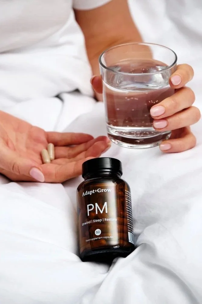 Lifestyle photography for a dietary supplement - a woman holding the product and a glass of water