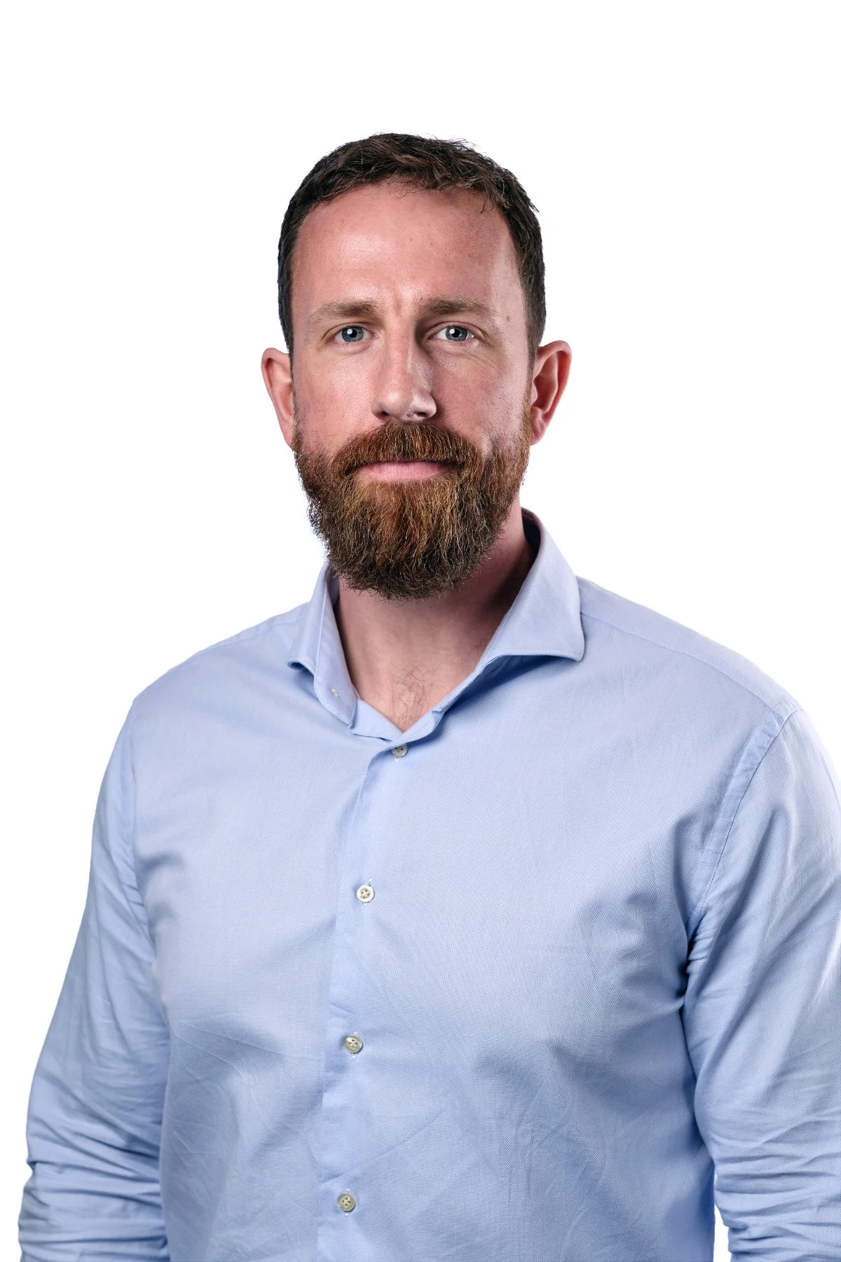 Professional headshot photograph for a man wearing a blue shirt, white background - Stratford-upon-Avon