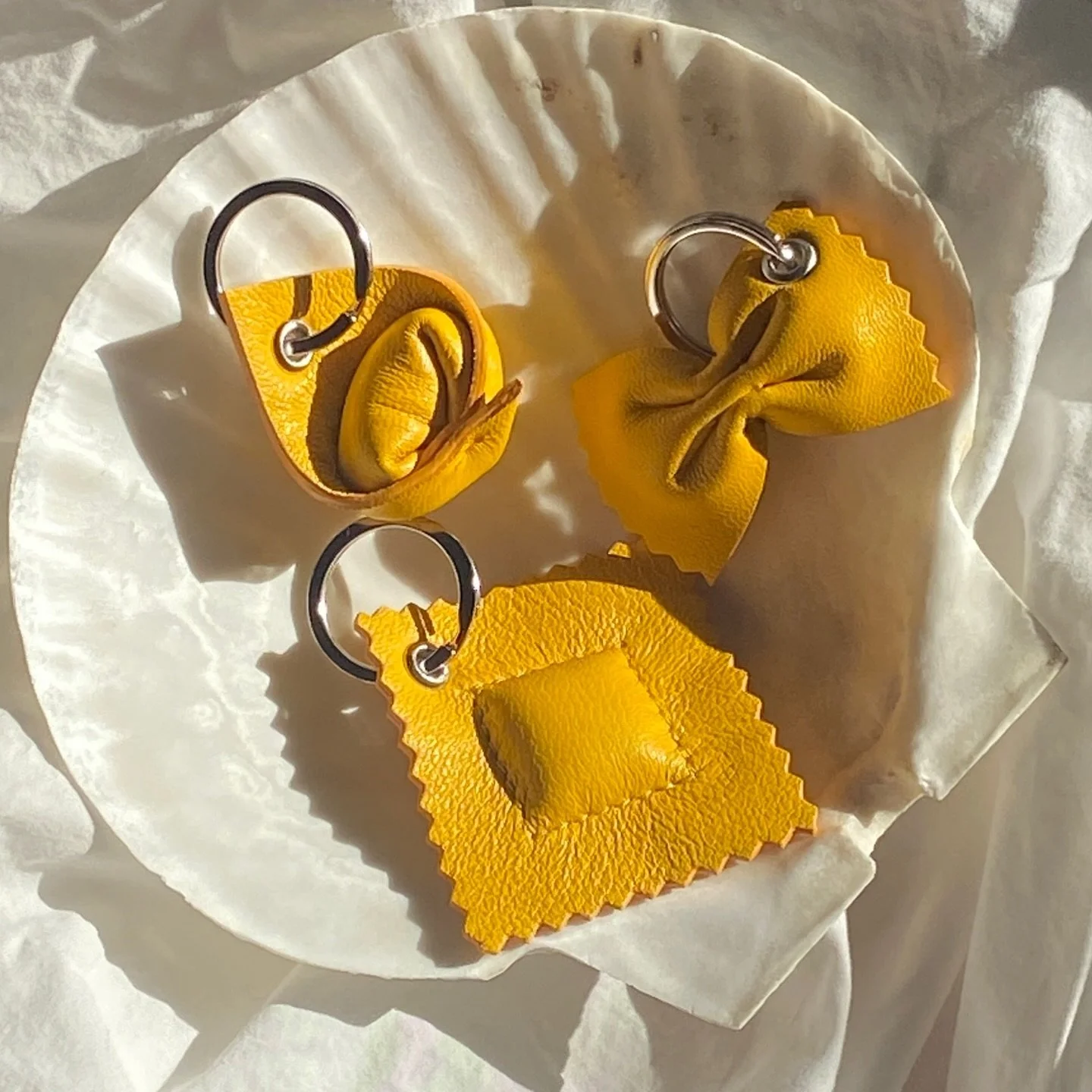 The ultimate pasta trio 🍝
Tortellini, Farfalle, and Ravioli leather keychain in our signature Egg Yolk. Three little icons, one deliciously charming keychain set.
Add a touch of whimsy to your keys&hellip; or gift one to your favourite carb lover 💛