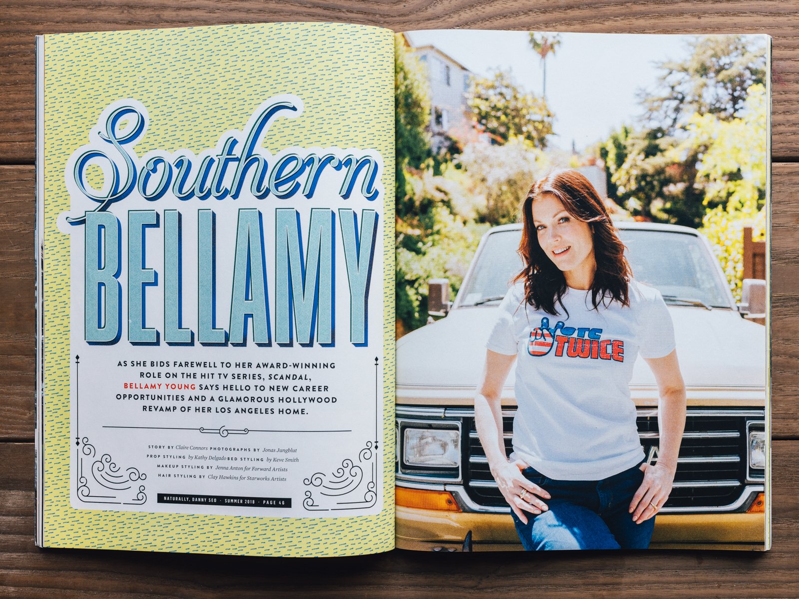 A magazine spread with the left page featuring the title 'Southern Bellamy' in stylized text and a short biography below, and the right page showing a woman with shoulder-length brown hair, wearing a white t-shirt with red and blue text, standing in 