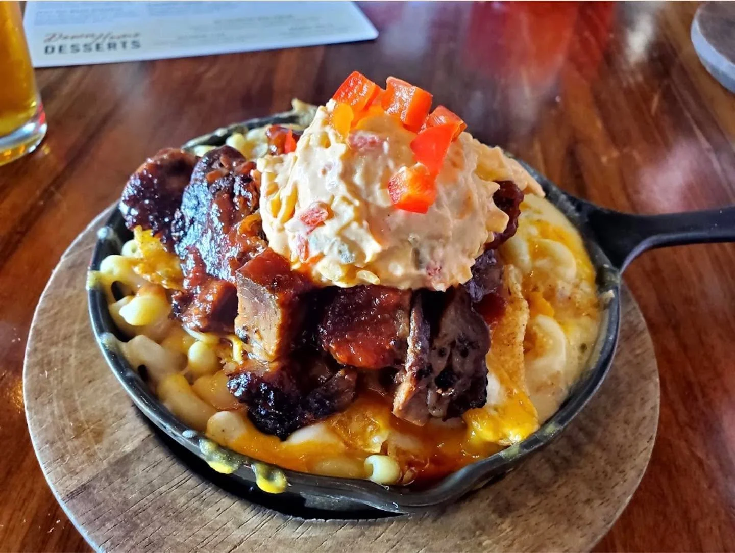 Burnt Ends Mac aka Daddy's favorite.

Our famous mac with the addition of white queso, brisket burnt ends, pimento cheese, pickles, Cheerwine BBQ sauce + a BBQ kettle chip crust. 🤤