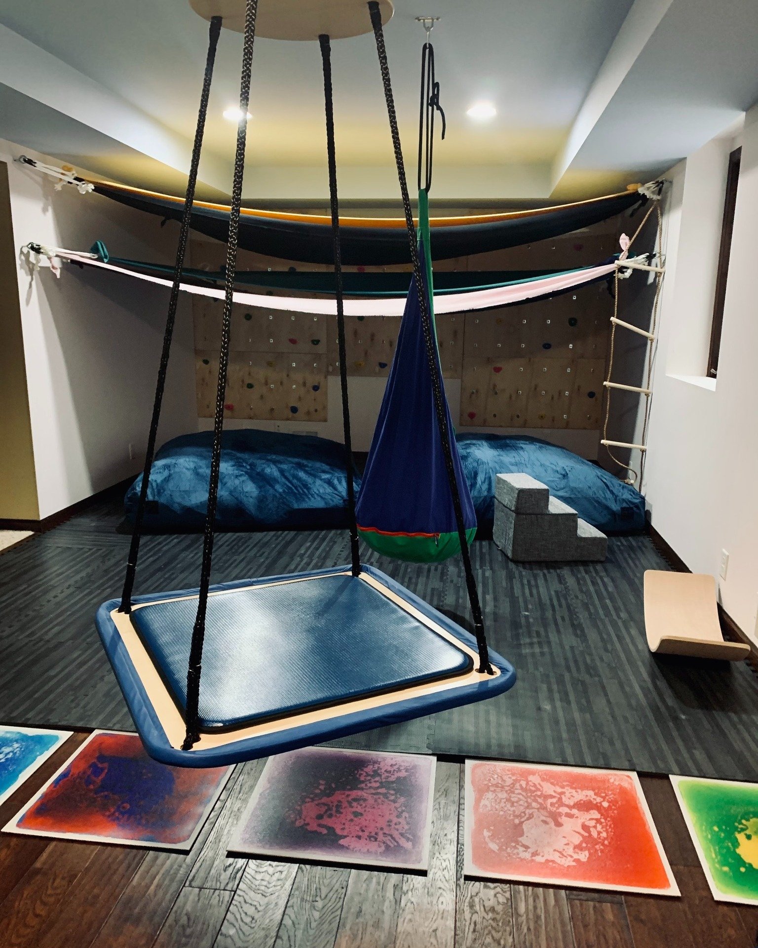 Check out this SENSE-ational sensory space! 🤩

Children seeking proprioceptive and vestibular sensory input benefit from climbing, crashing, swinging, and spinning. Adding elements like swings, lycra suspensions, or rock walls provides opportunities