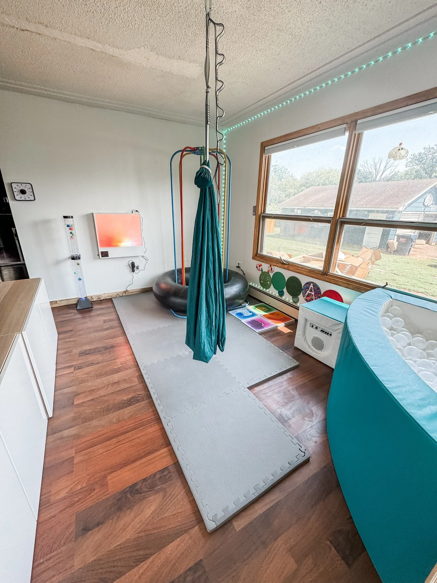 What other sensory supports can you spy in this space? 👀

🔍I spy...

- Sensory gel tiles: help participate in gross motor activities while providing visual and tactile experience
- Vibroacoustic Ball Pit: combines tactile input with music-based vib