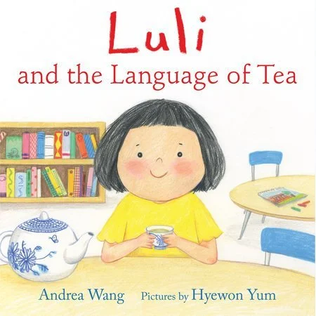 Book cover. A smiling Chinese girl holds a tea cup matching the teapot on the table. Behind her is a bookshelf and another table with a small chair. Text: "Luli and the Language of Tea. Andrea Wang. Pictures by Hyewon Yum."