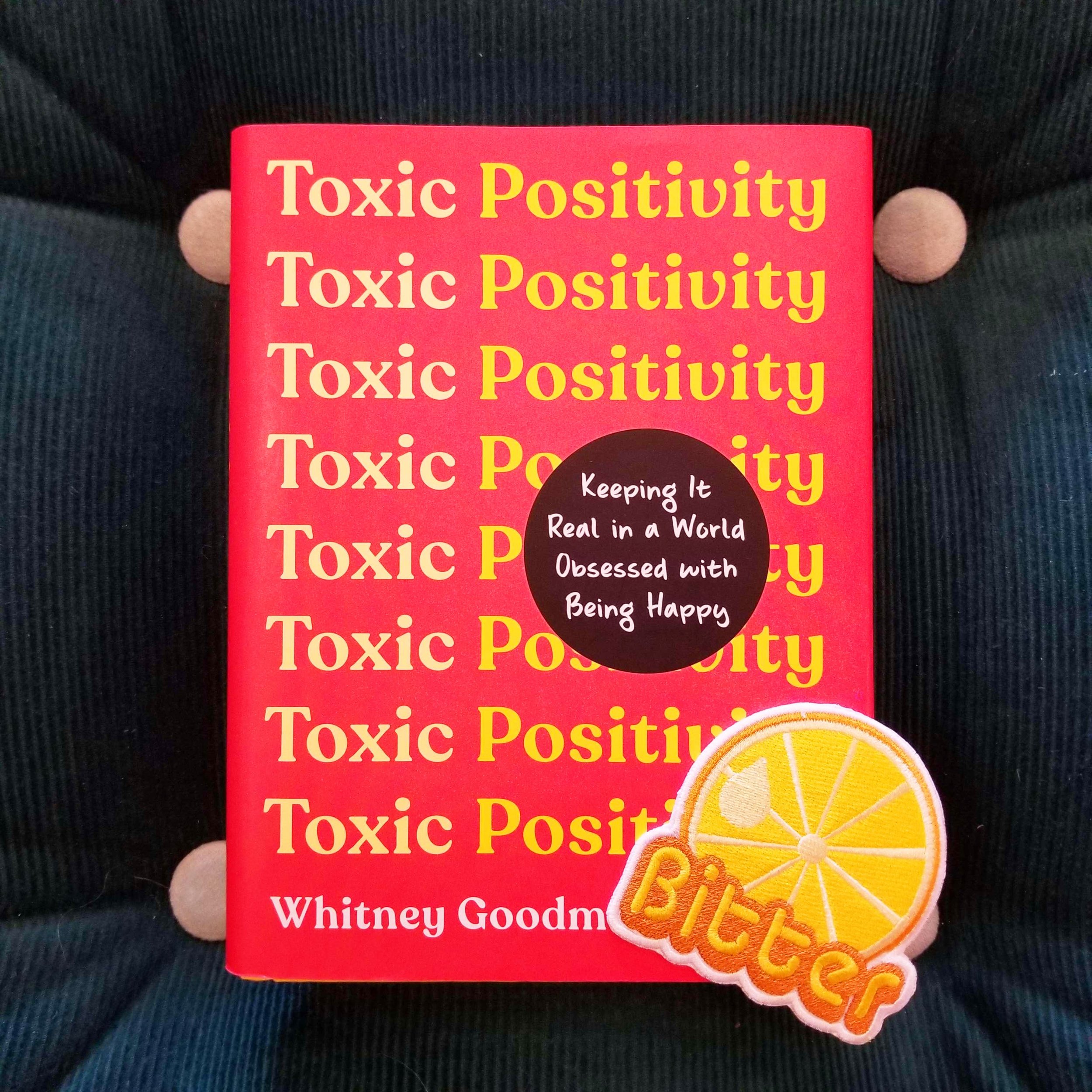 Book cover solid red with the repeated words "toxic positivity"