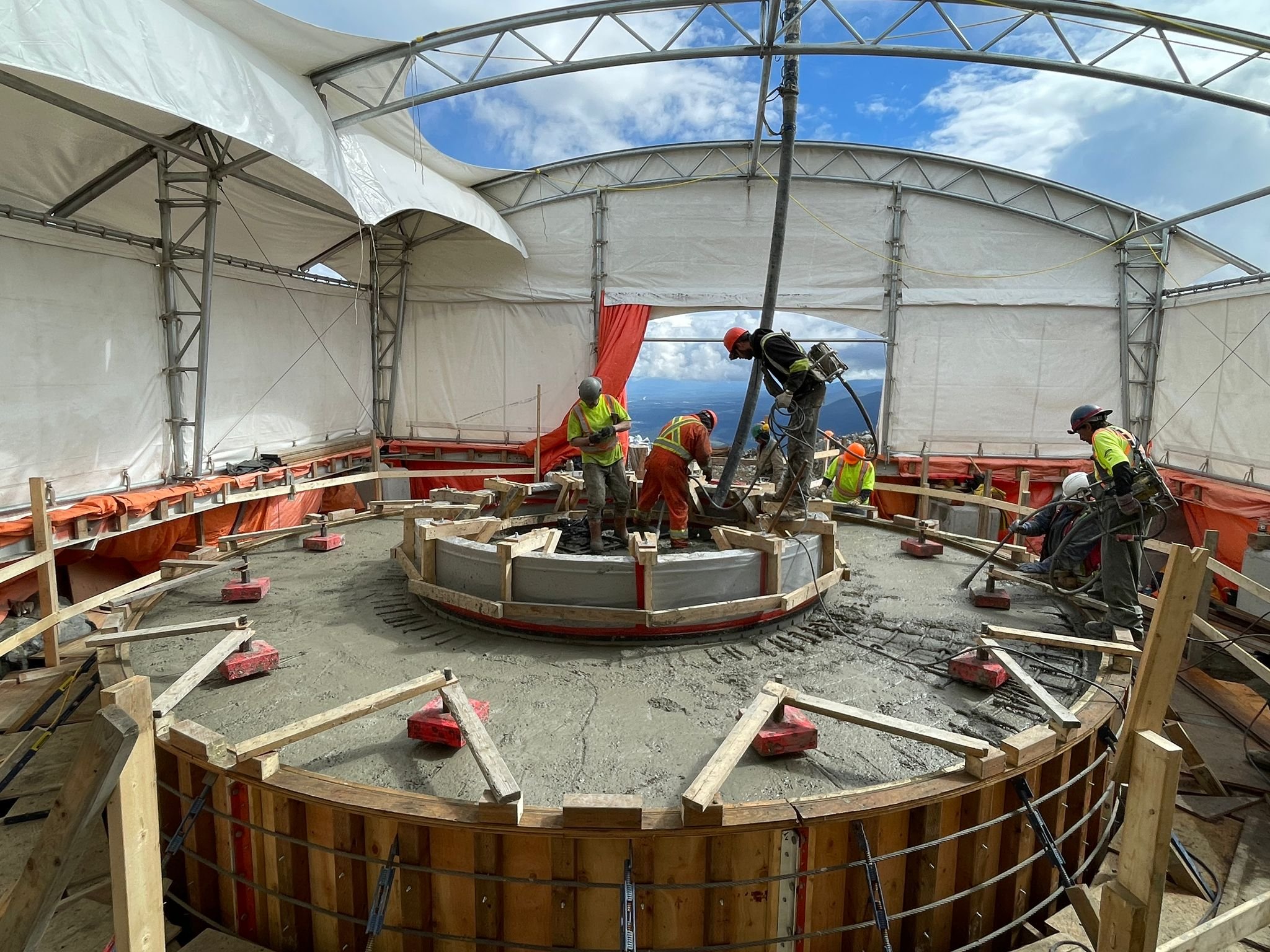 Concrete foundations poured with anchor rods installed for support, Summer 2022