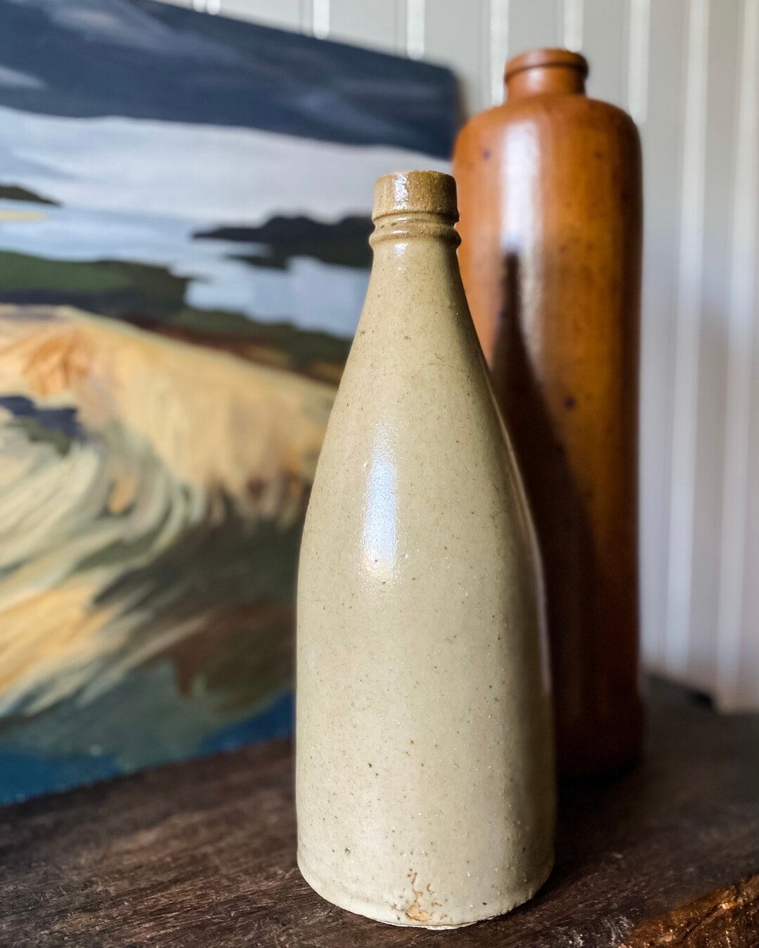 among my favorite finds for @jettyhousevintage (so far) were these stoneware bottles. styled with a vintage seascape from my personal collection.  feels spot on for a summer cottage.