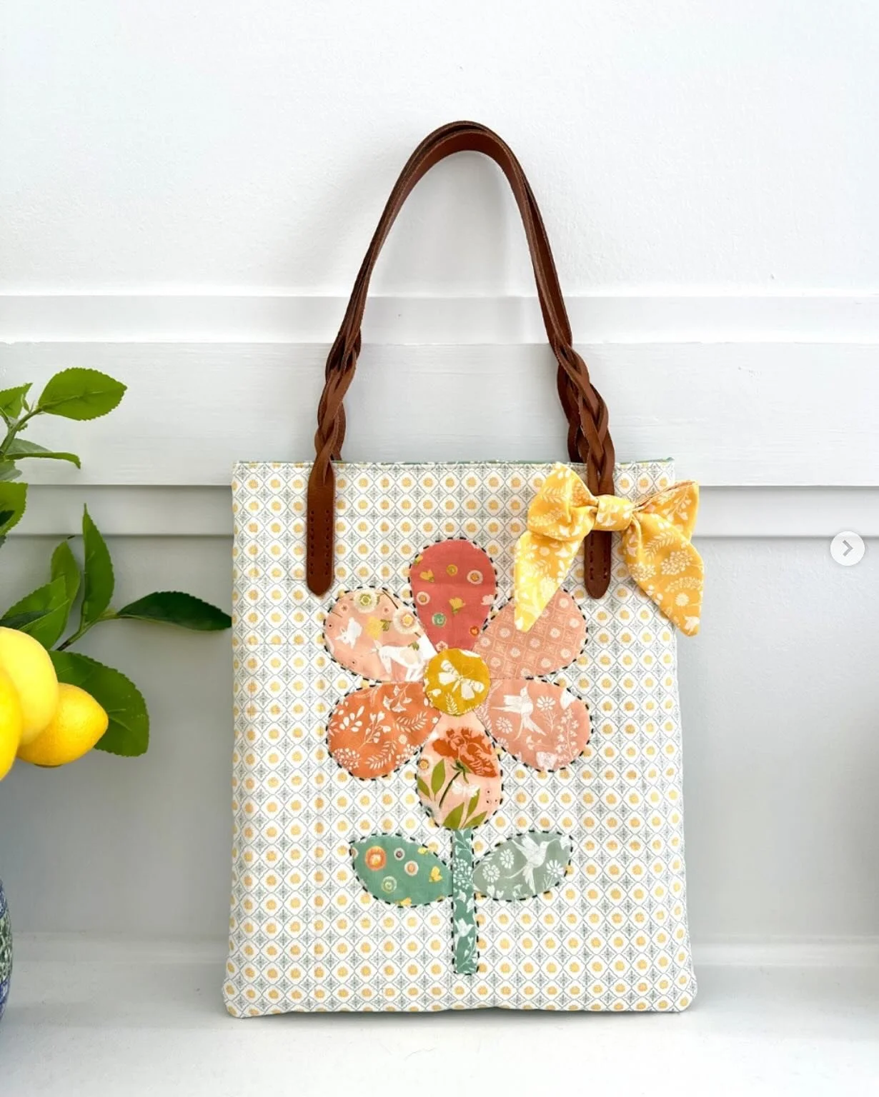 LOVE this bag by @sarabquilts 💗💗💗 Swipe to see all the lovely details including her appliqu&eacute;, hand-stitching, and the sweetest yellow bow. I can&rsquo;t tell you how much it fills my heart to see others take my fabric and turn it into their