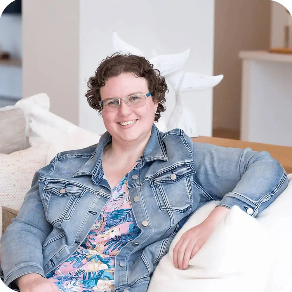 Photo of Sez from Whale Tail Digital relaxed on a couch