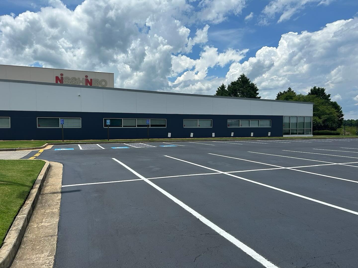 This lot got a makeover during the 4th holiday! See the before on the last slide -&gt; #sealcoating #crackfill