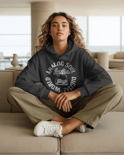 modern-living-room-hoodie-mockup-female-model-sitting-cross-legged-on-sofa-01803.jpg