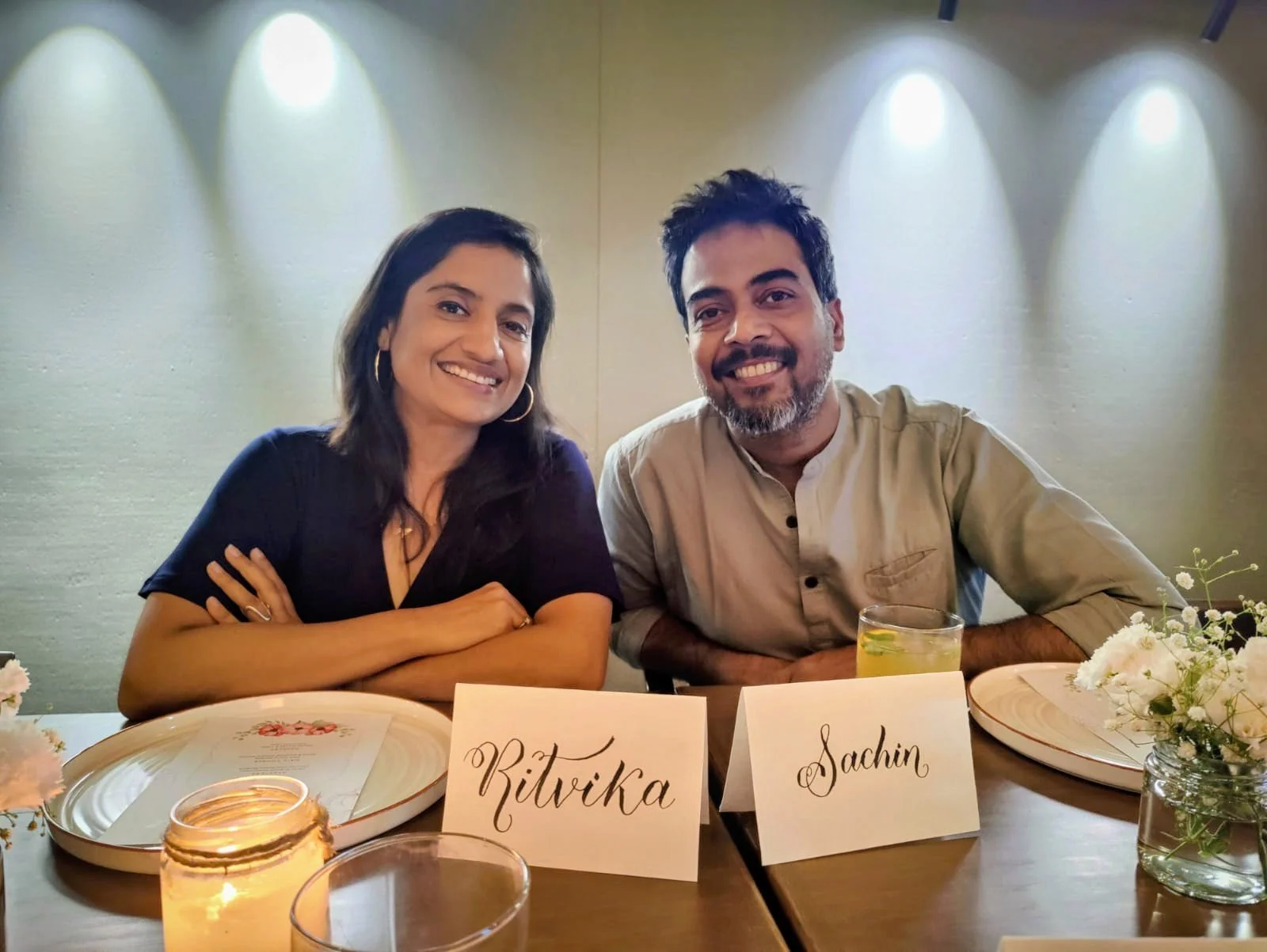 Sachin Ritvika seated on a dining table afterparty