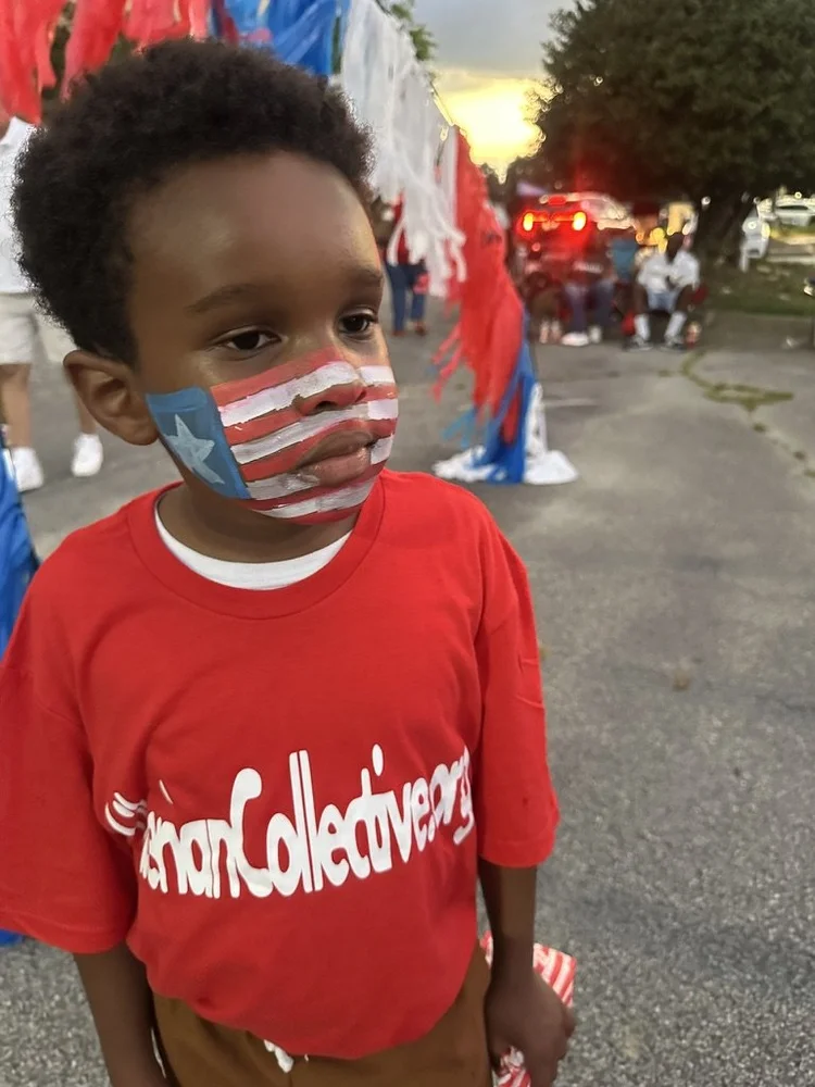 Child celebrating Liberian culture with Liberian flag face paint