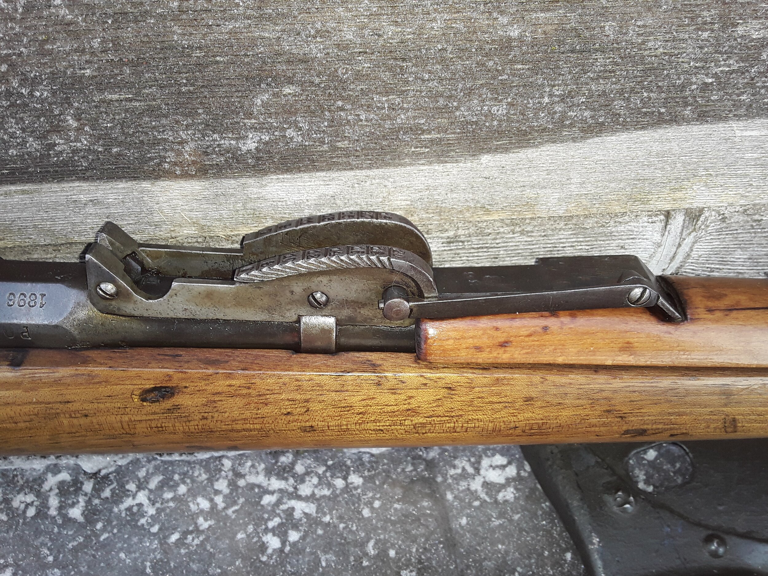 The distinctive rear sight of the original M1891 rifle. In this position, the 300 meter battle sight is exposed, the leaf can be rotated rearward to sit in the 450 meter position, before being adjusted in 100 meter increments from 600 to 2,000 meters