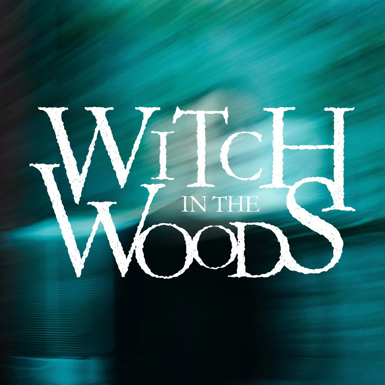 Title graphic for 'Witch in the Woods' with a blurred forest background.