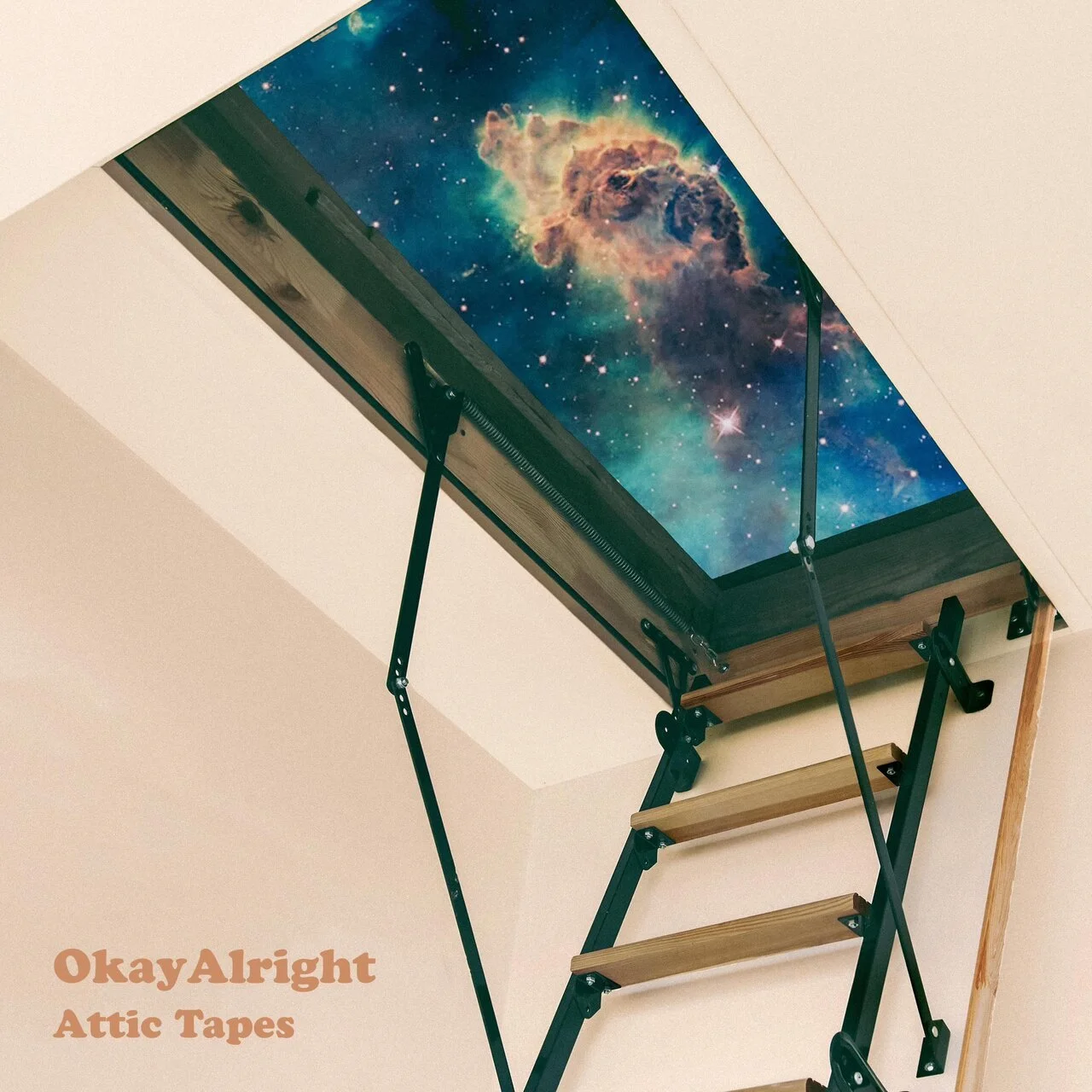 Ceiling hatch with a space-themed image of a nebula, accessed via a folding wooden ladder.