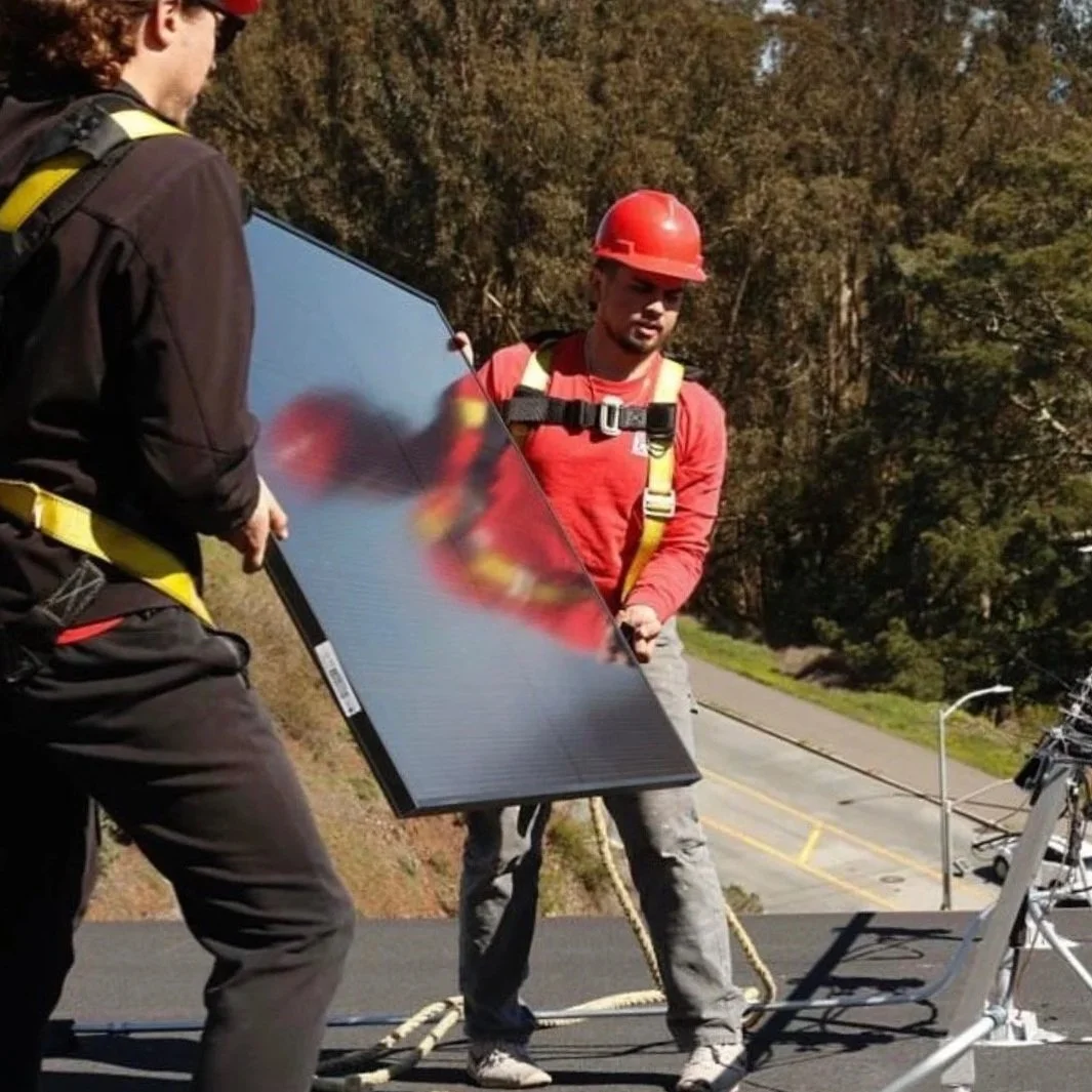Tommy Installing a Solar Panel featured in a San Francisco Chronicle Article