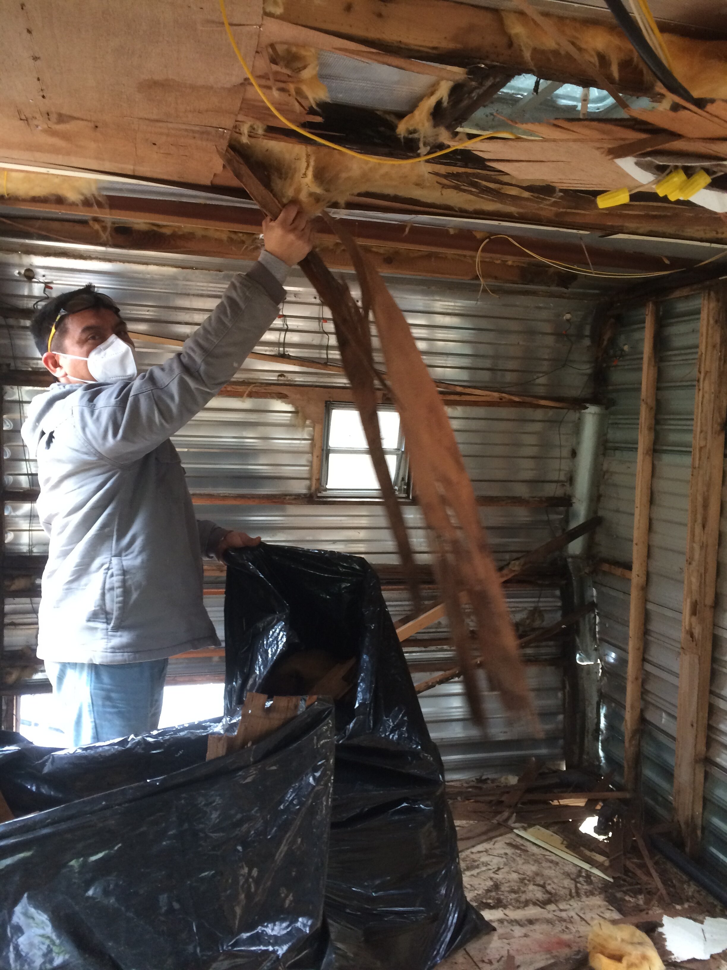Jose Pech helped rip out Margie's old ceiling, certainly the funkiest part of the demolition and for which I wore an old flight suit (thanks Mike Bibeau), goggles, gloves, as well as a face mask.