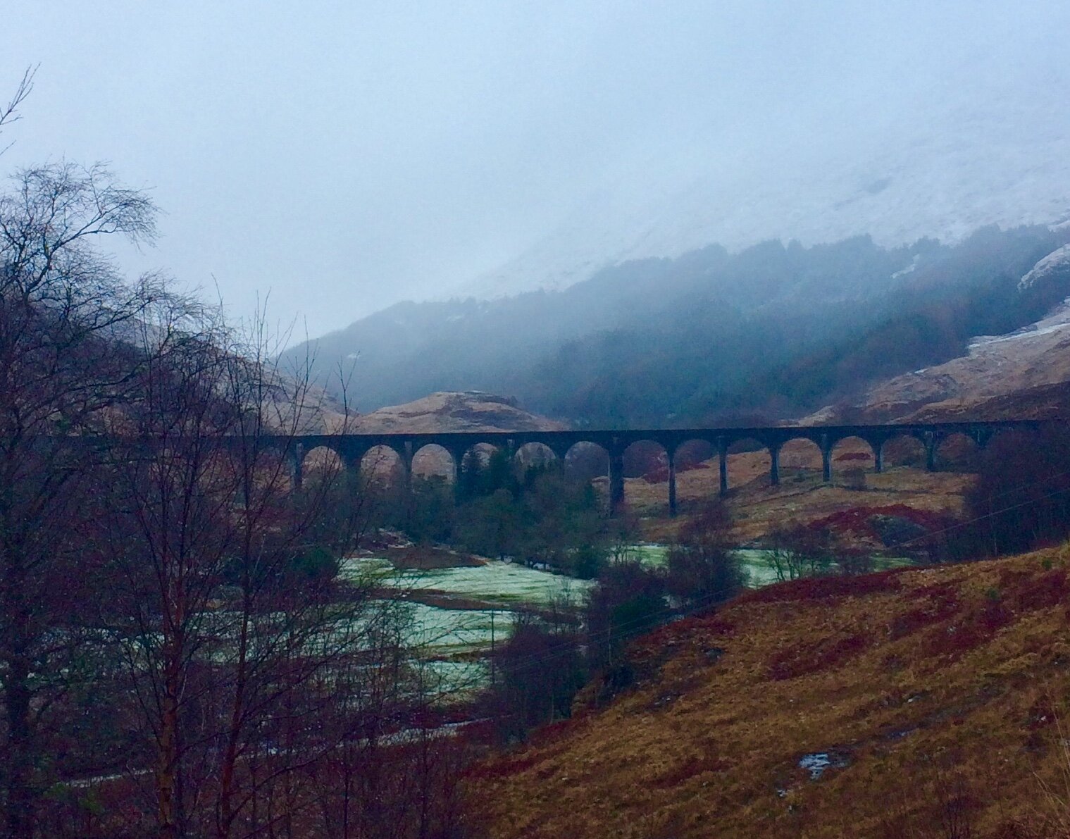 Harry Potter fans will recognize this scene. From the same spot where the Glenfinnan Monument can been seen at the top of Loch Shiel, turn and look in the opposite direction to view the Glenfinnan Viaduct which is part of the West Highland Line railw