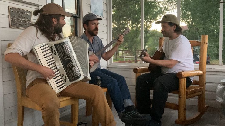 Hotel staff Matt, Josh and Conlan jammin' on the front porch.