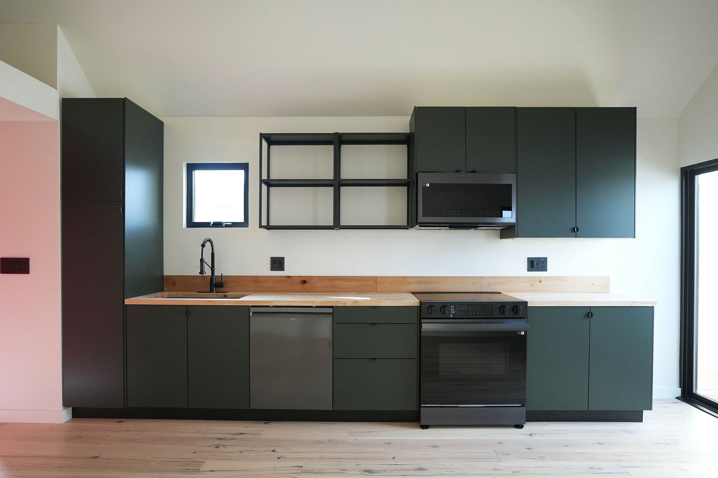 national-city-adu-modern-kitchen-interior-green-cabinets.jpg