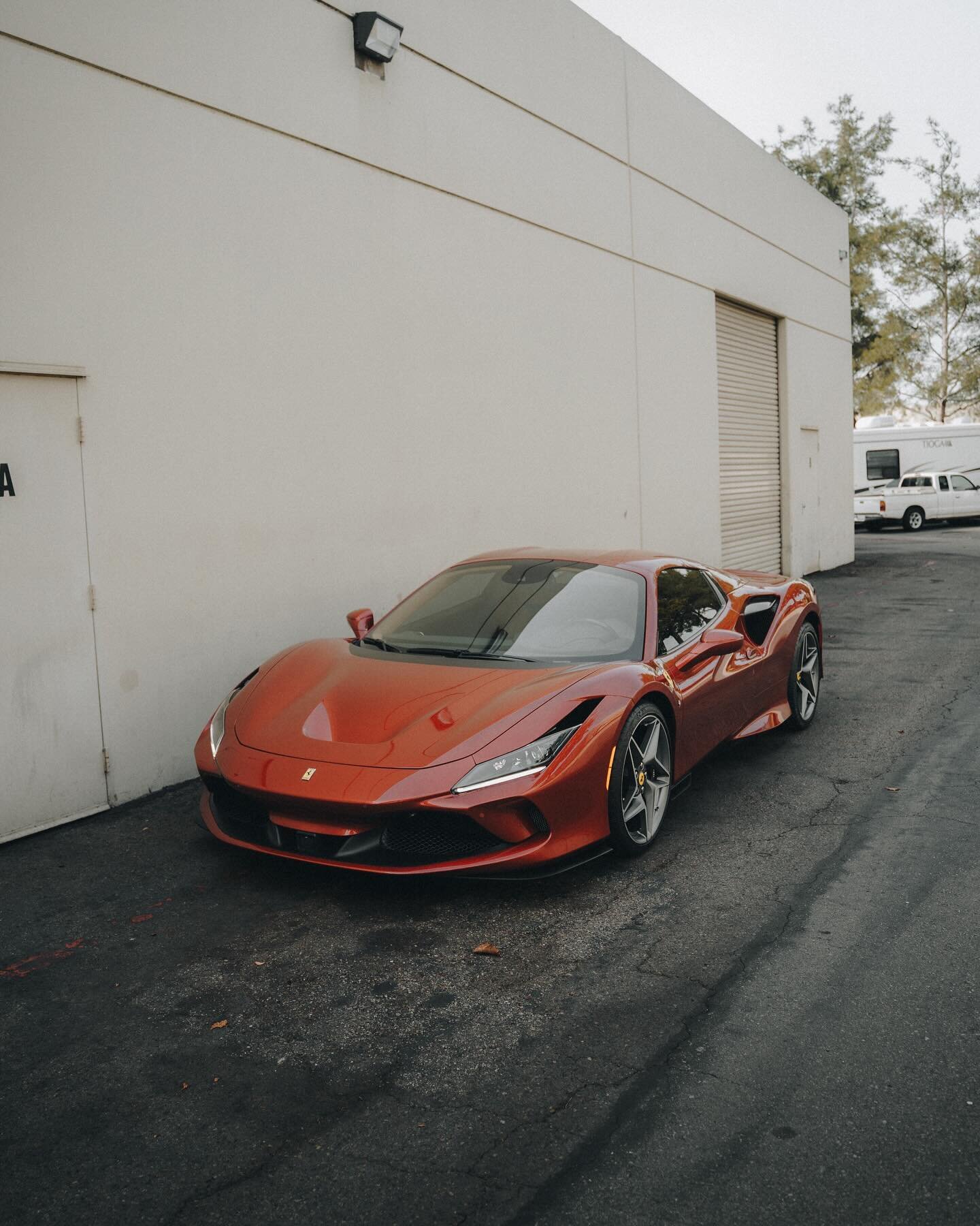 Sporting a darker red paint than a typical Ferrari, this Ferrari F8 came to us in search of front end protection. Applying our expertise with @XPEL PPF, we skillfully wrapped the front bumper, hood, fenders, headlights, and side mirrors in our protec