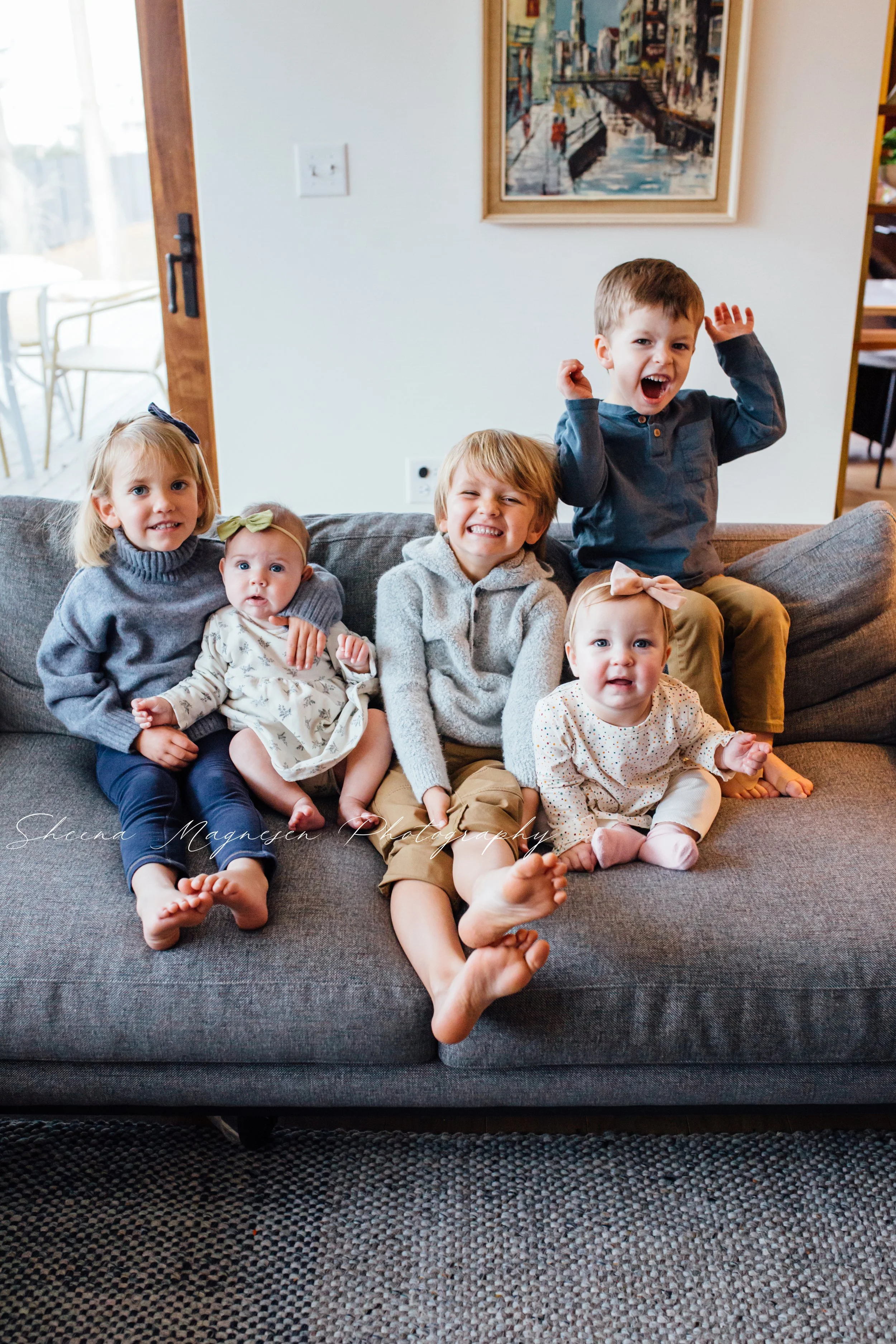 Candid in-home family photo session in a cozy living room with Naperville family photographer Sheena Magnesen