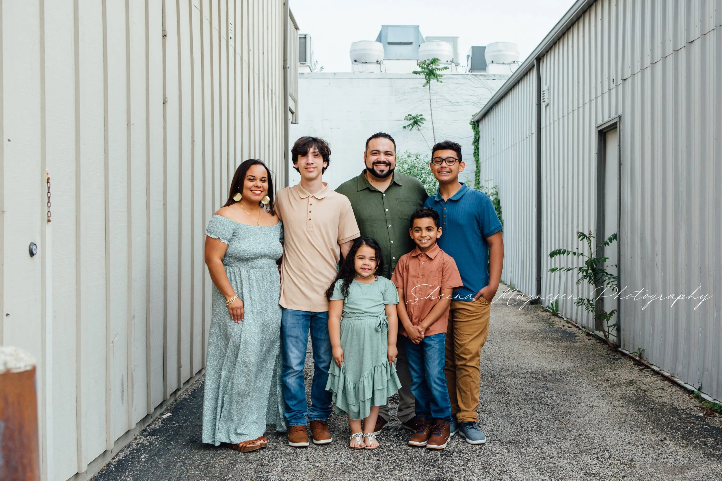 Family photo session on brick streets of downtown Plainfield IL, casual and candid outdoor portrait photography