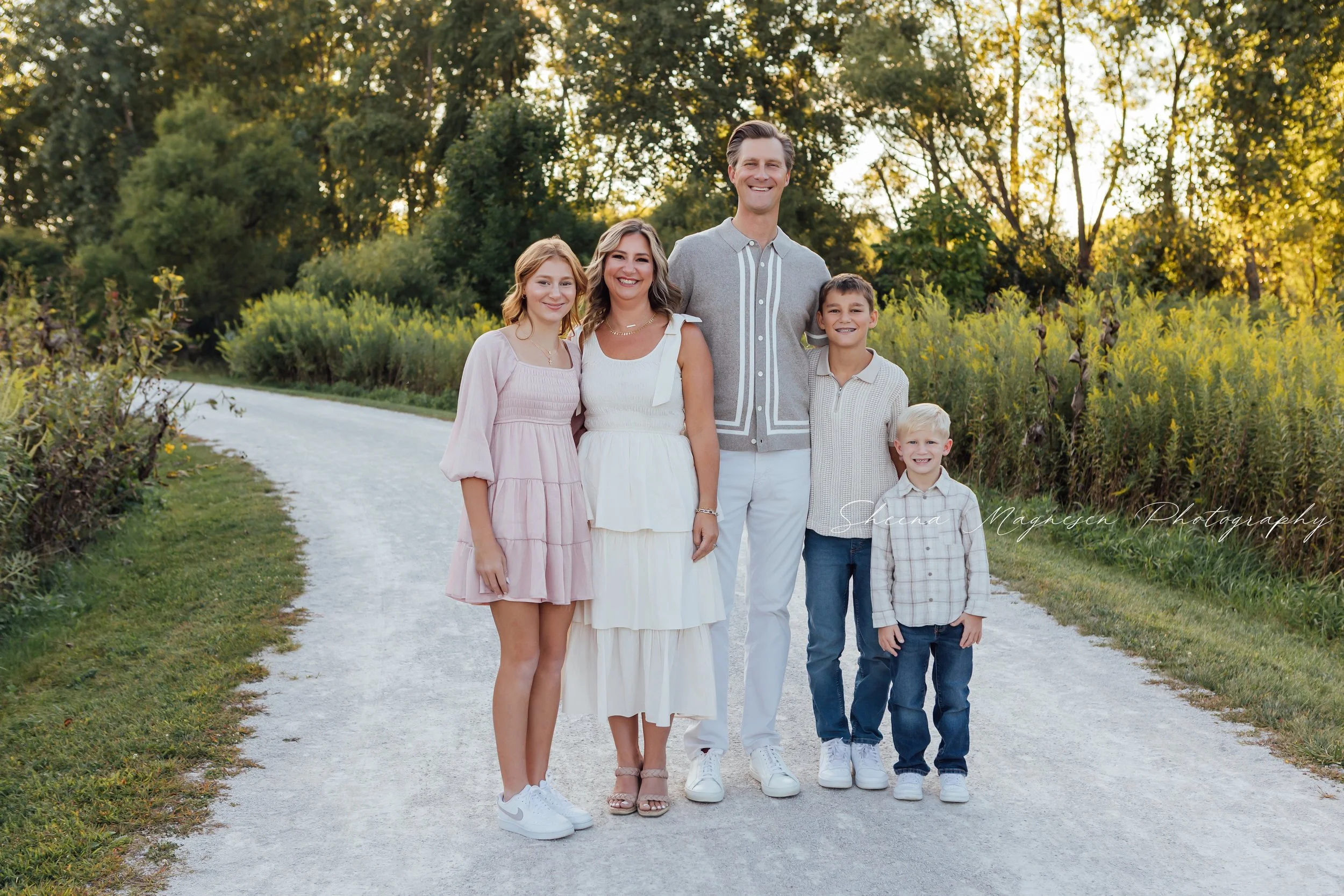 Family posing together during a golden hour sunset family photography session in Naperville.