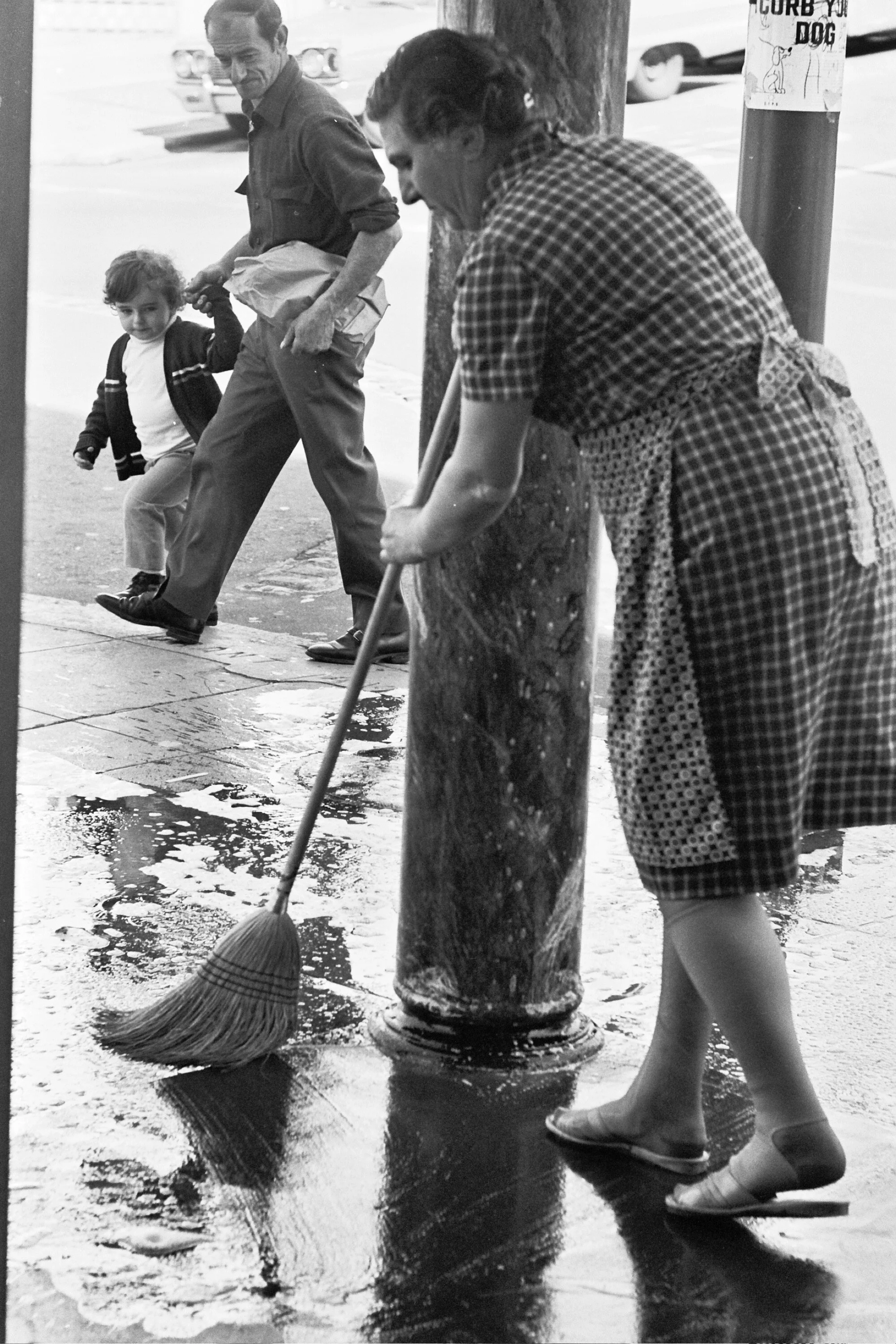 WOMAN SWEEPING WITH A BROOM.jpg